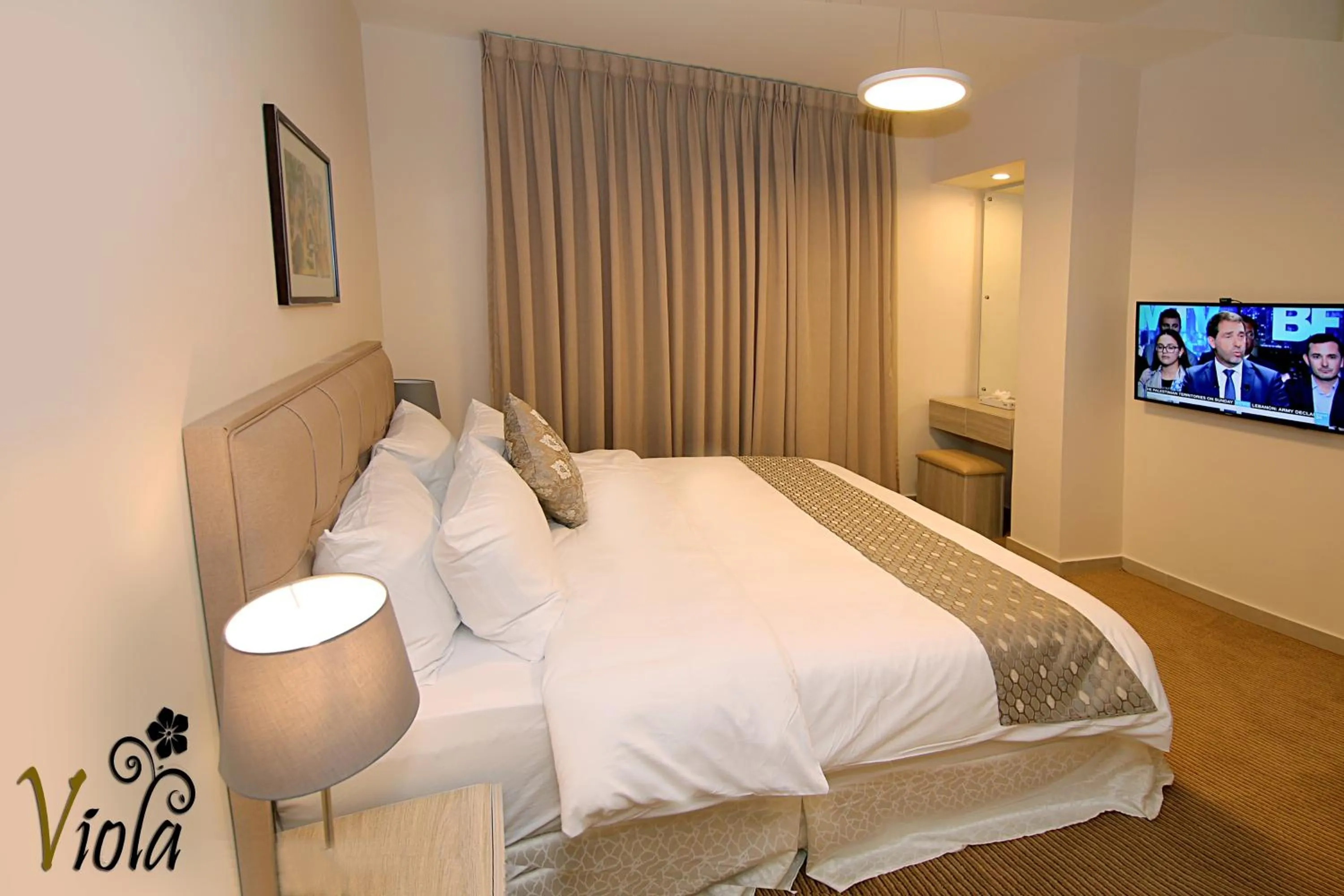 Bed in Viola Hotel Suites