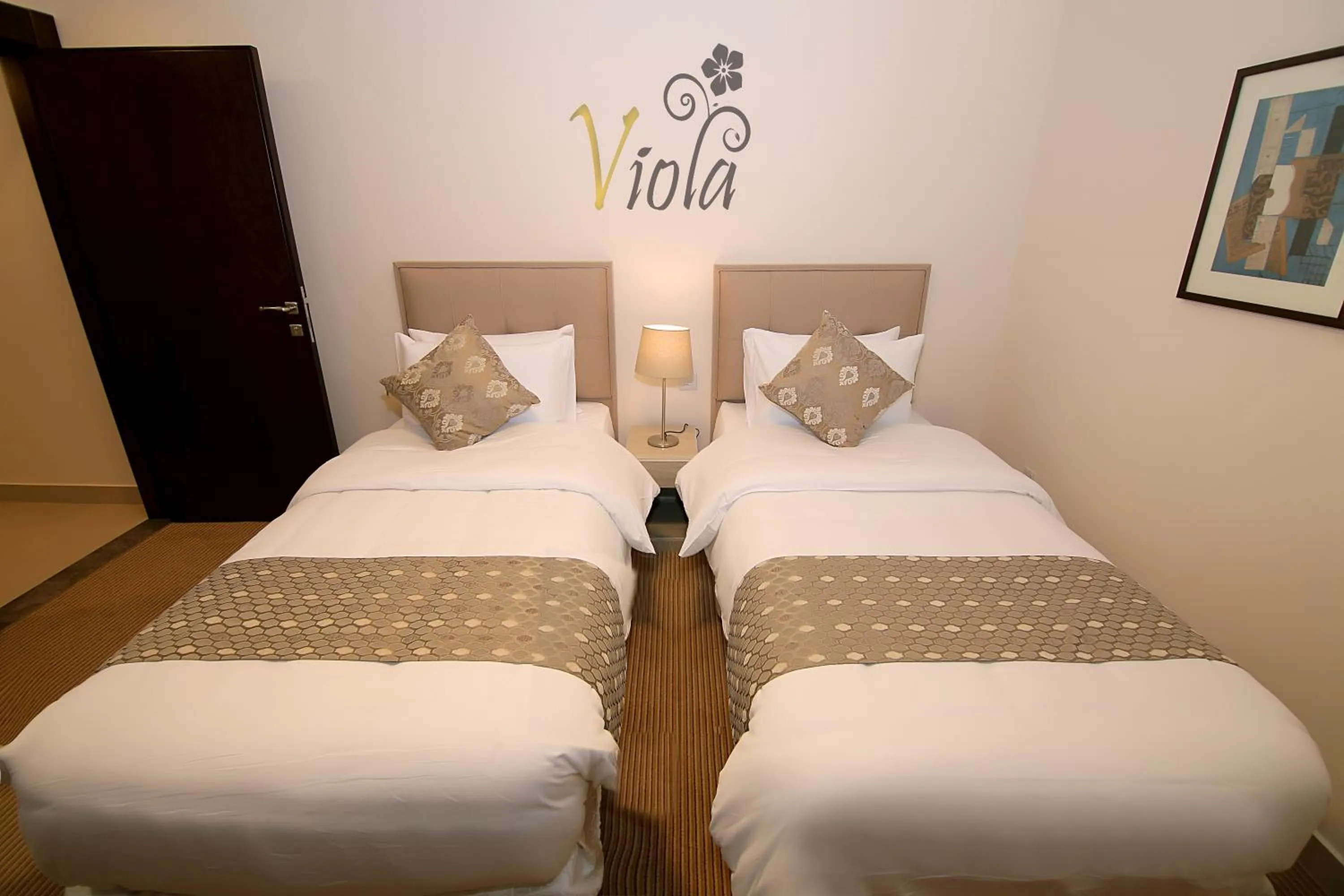 Bed in Viola Hotel Suites