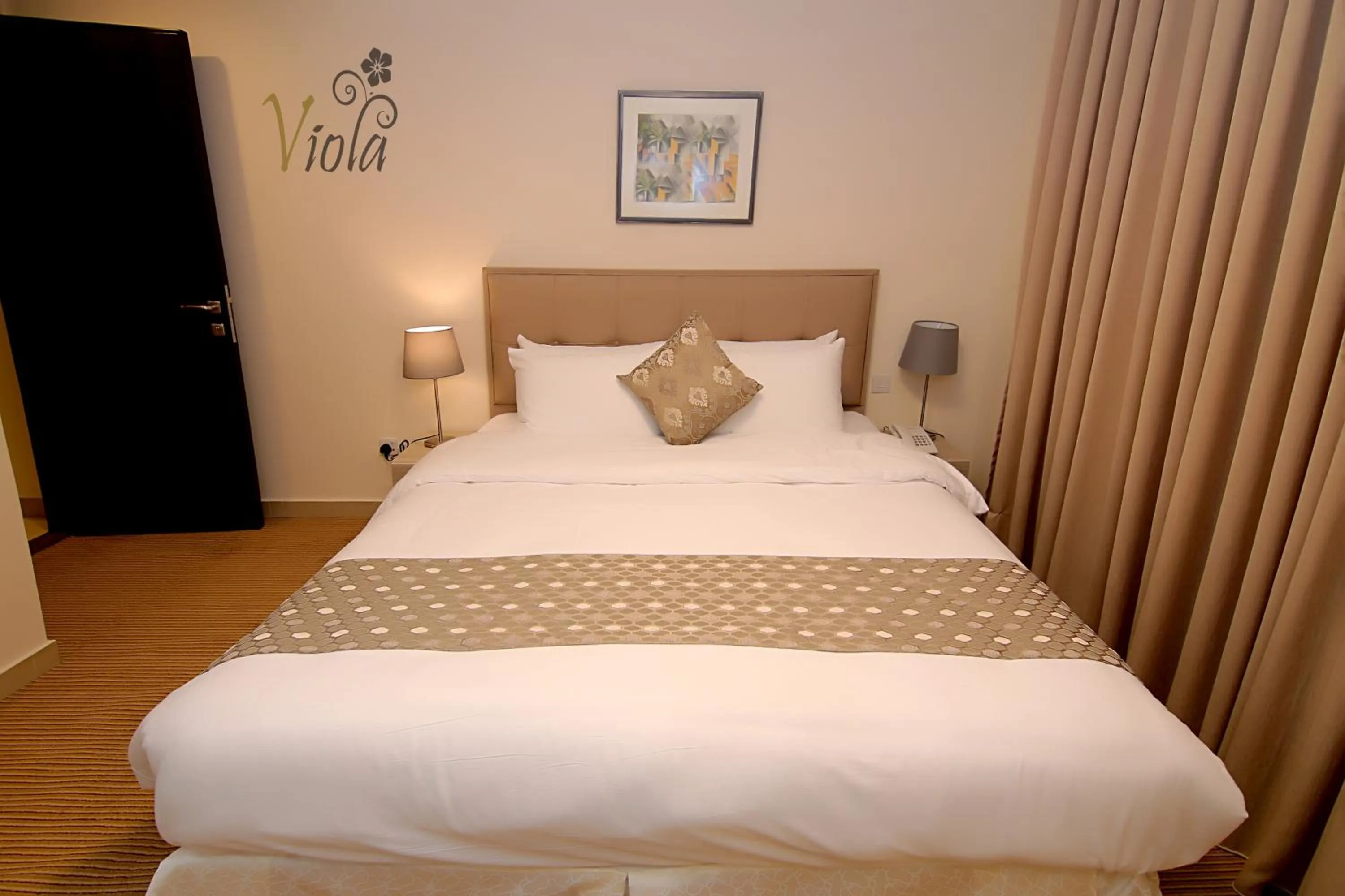 Bed in Viola Hotel Suites