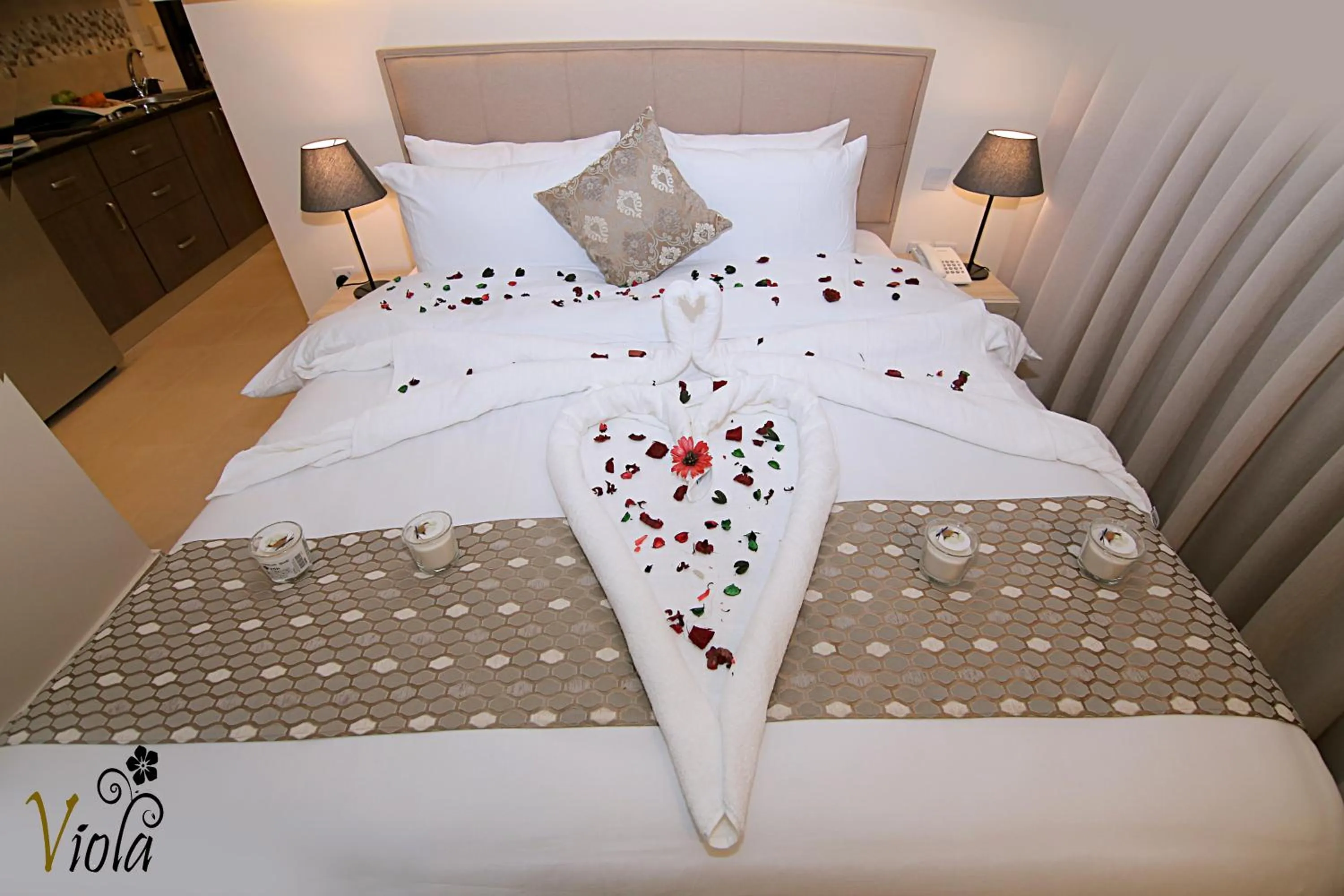 Bed in Viola Hotel Suites