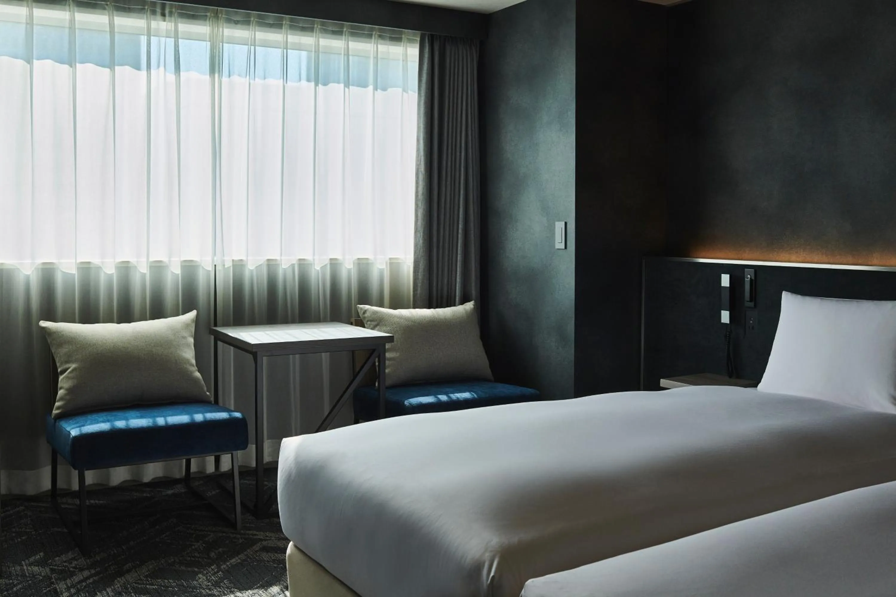 Bed in Cross Hotel Sapporo