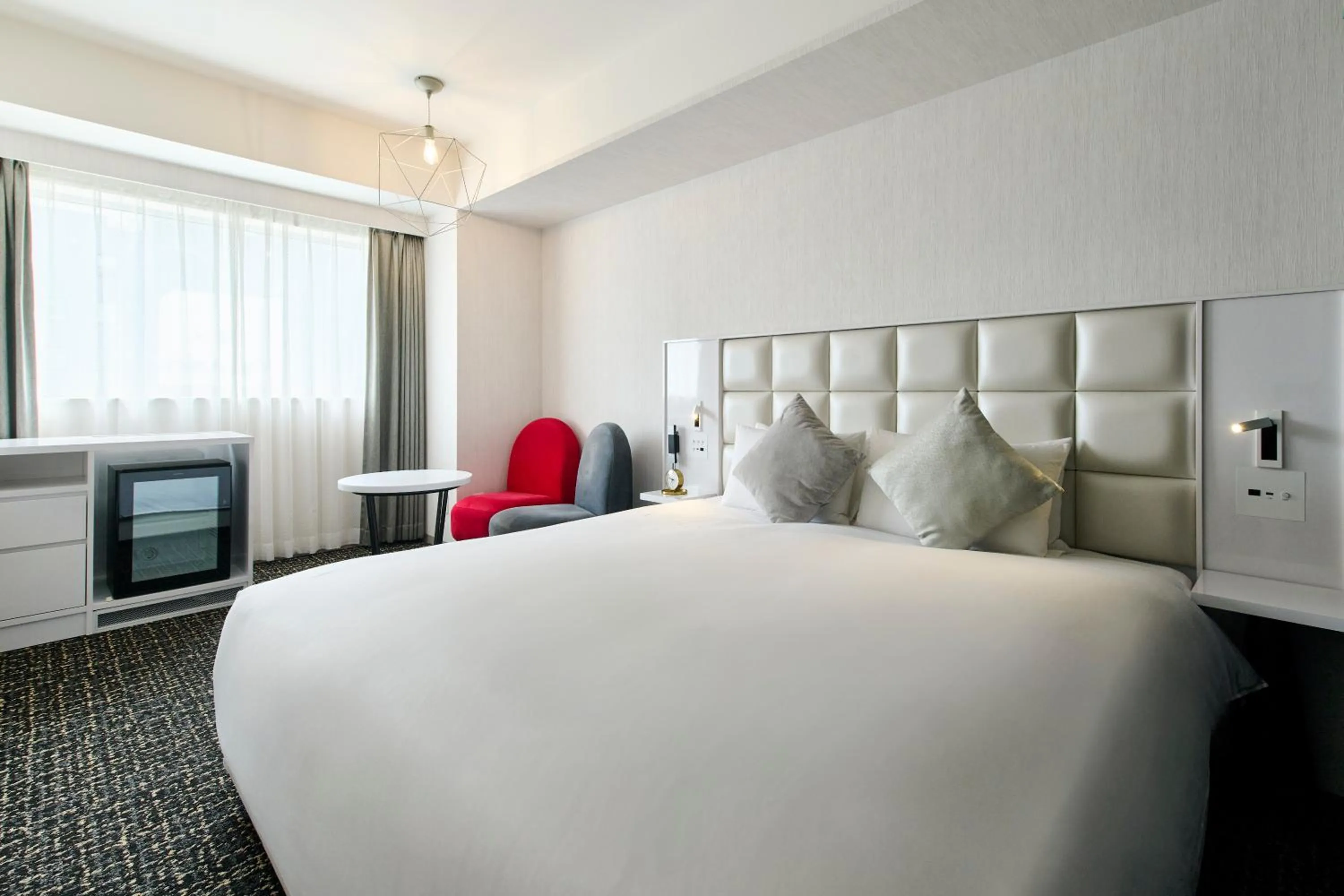 Bed in Cross Hotel Sapporo