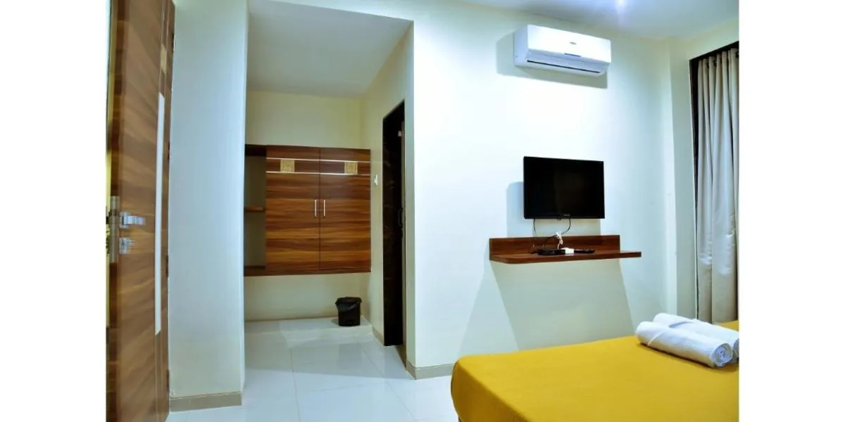 Bed in Hotel Sadhana Executive