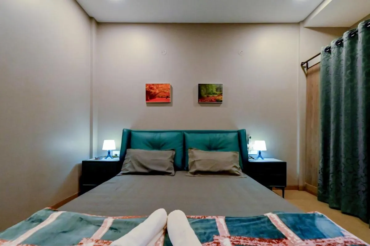 Bed in Hotel Sadhana Executive