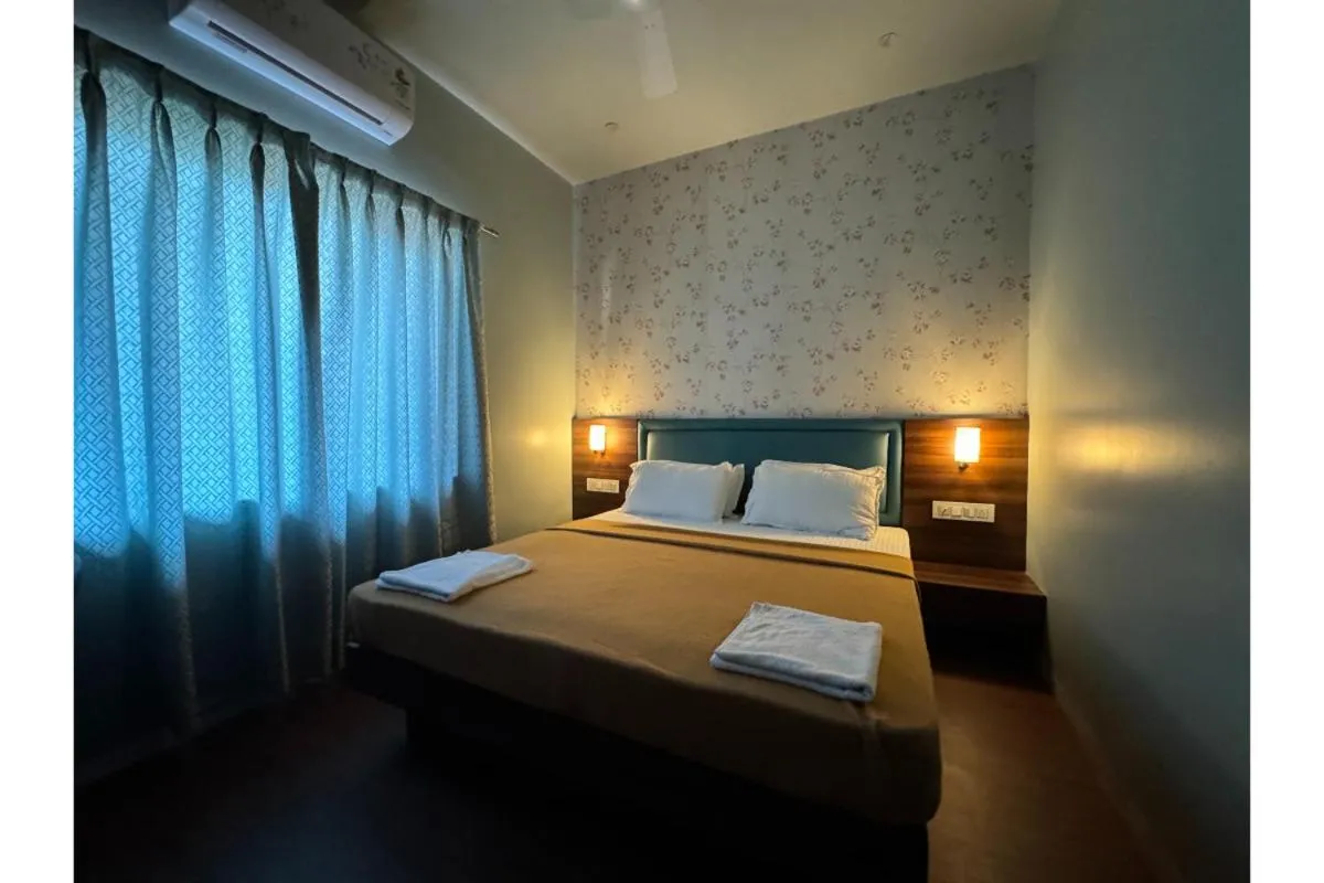 Bed in Hotel Sadhana Executive