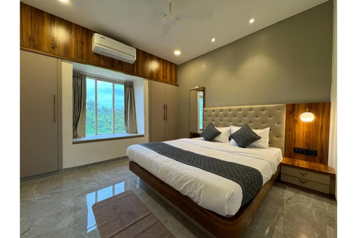 Bed in Hotel Sadhana Executive