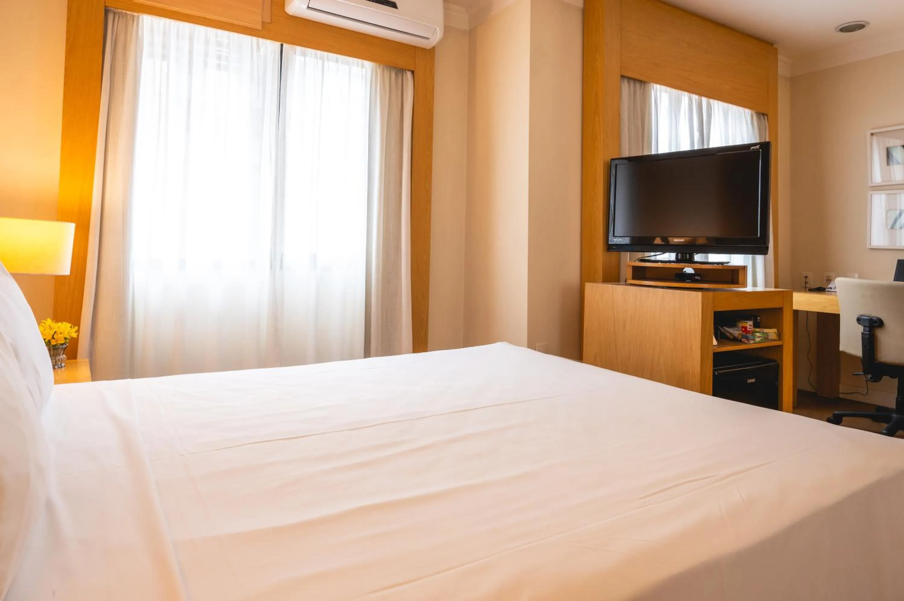 Bed in eSuítes Congonhas by Atlantica