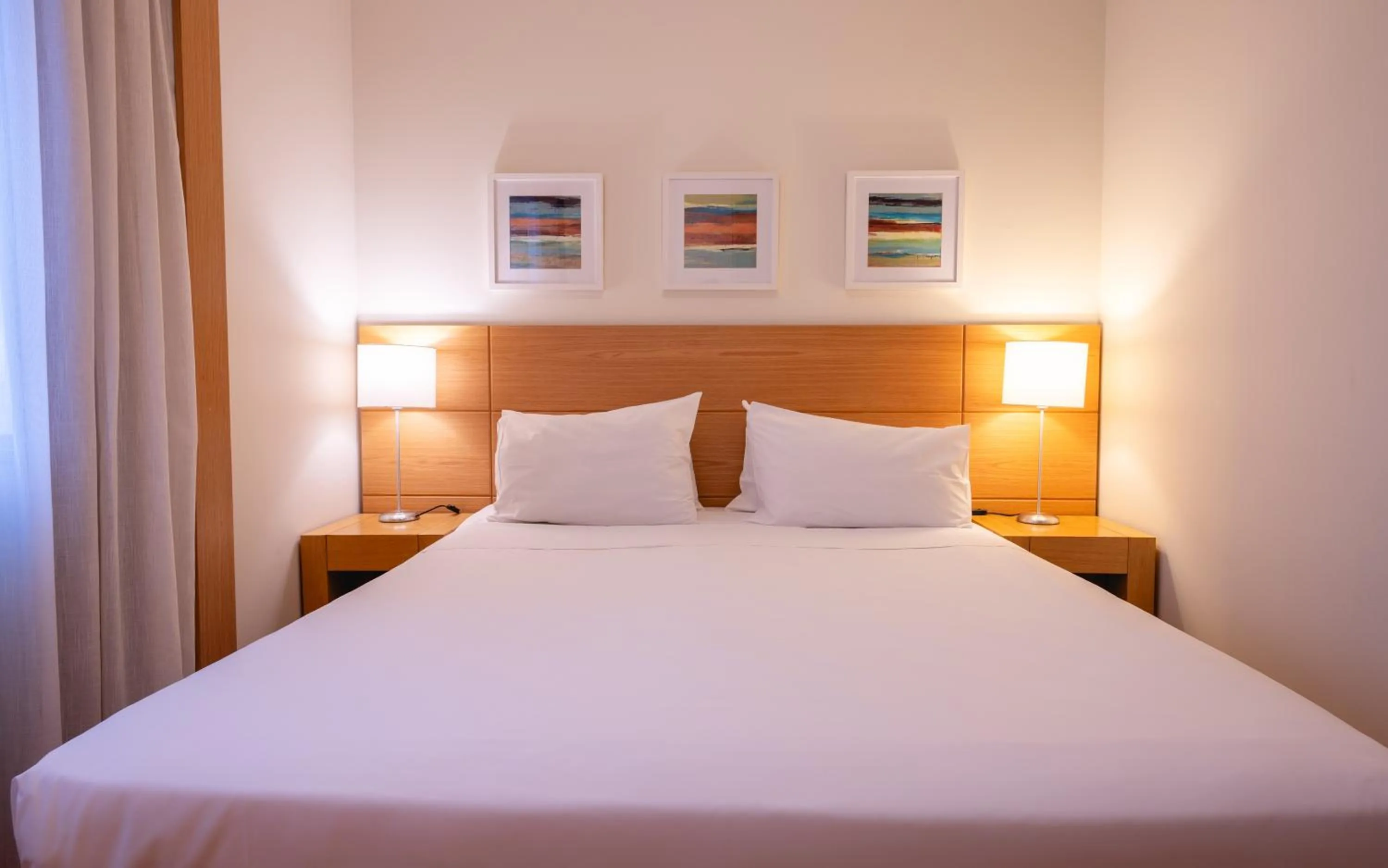 Bed in eSuítes Congonhas by Atlantica