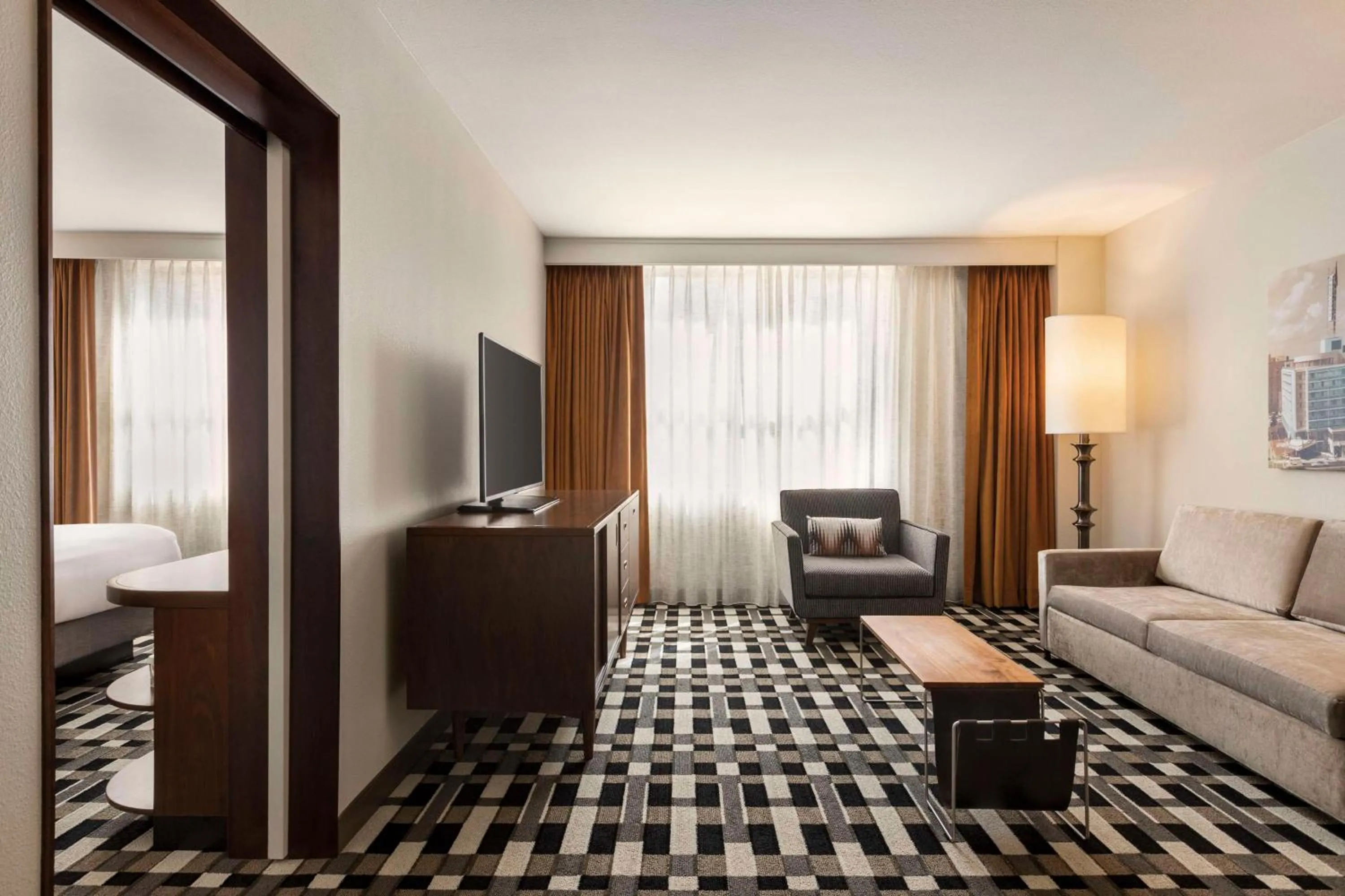 Living room, Bed in The American Hotel Atlanta Downtown-a Doubletree by Hilton