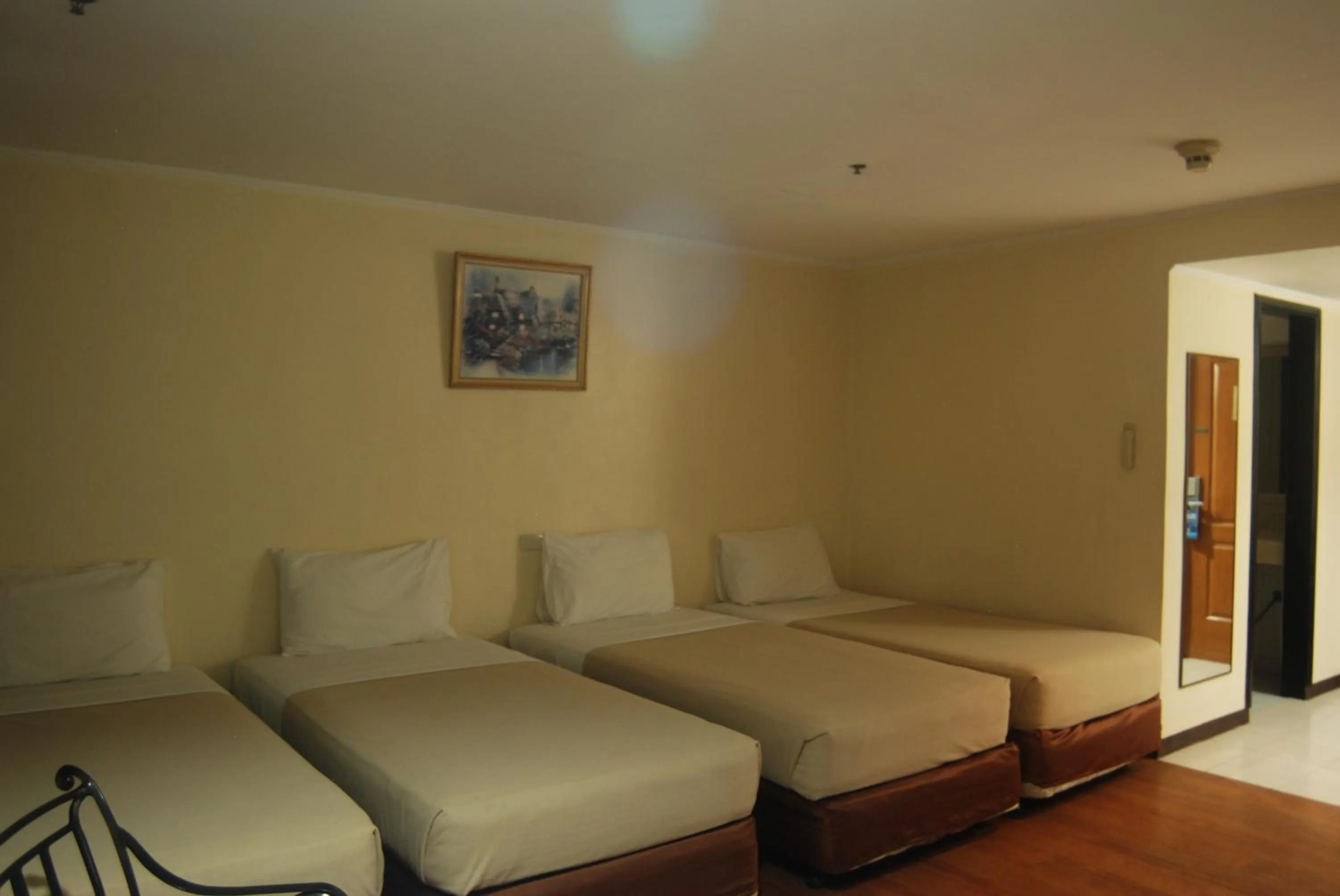 Deluxe Quadruple Room in Golden Peak Hotel & Suites powered by Cocotel