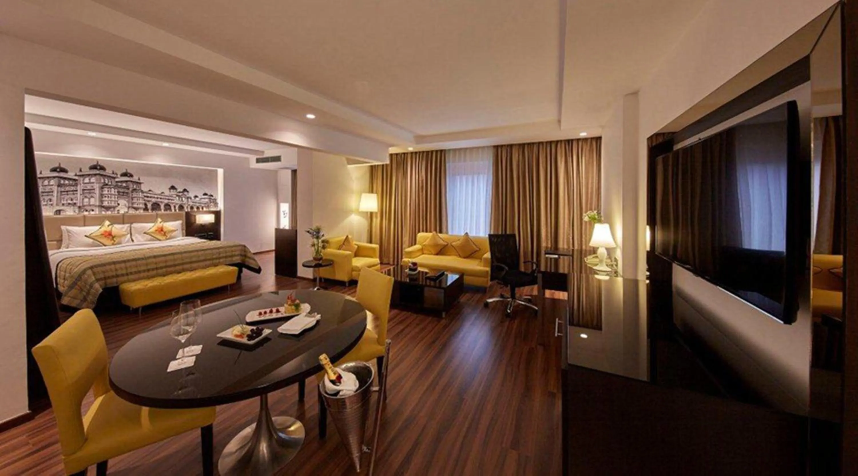 Living room, Bed in Hotel Royal Orchid Bangalore