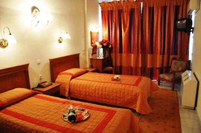 Bed in Famissi Eden Hotel