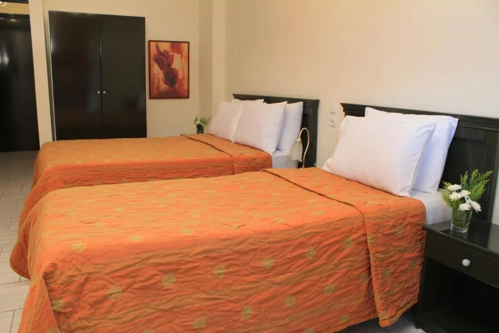 Bed in Famissi Eden Hotel