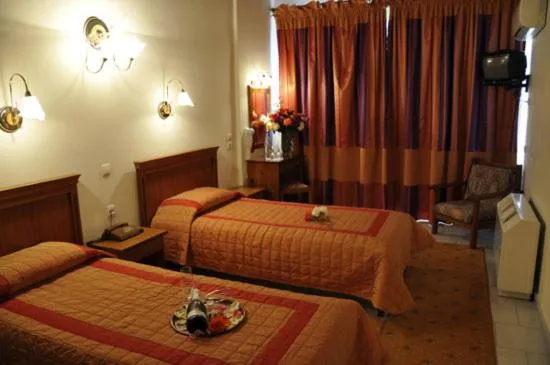 Bed in Famissi Eden Hotel