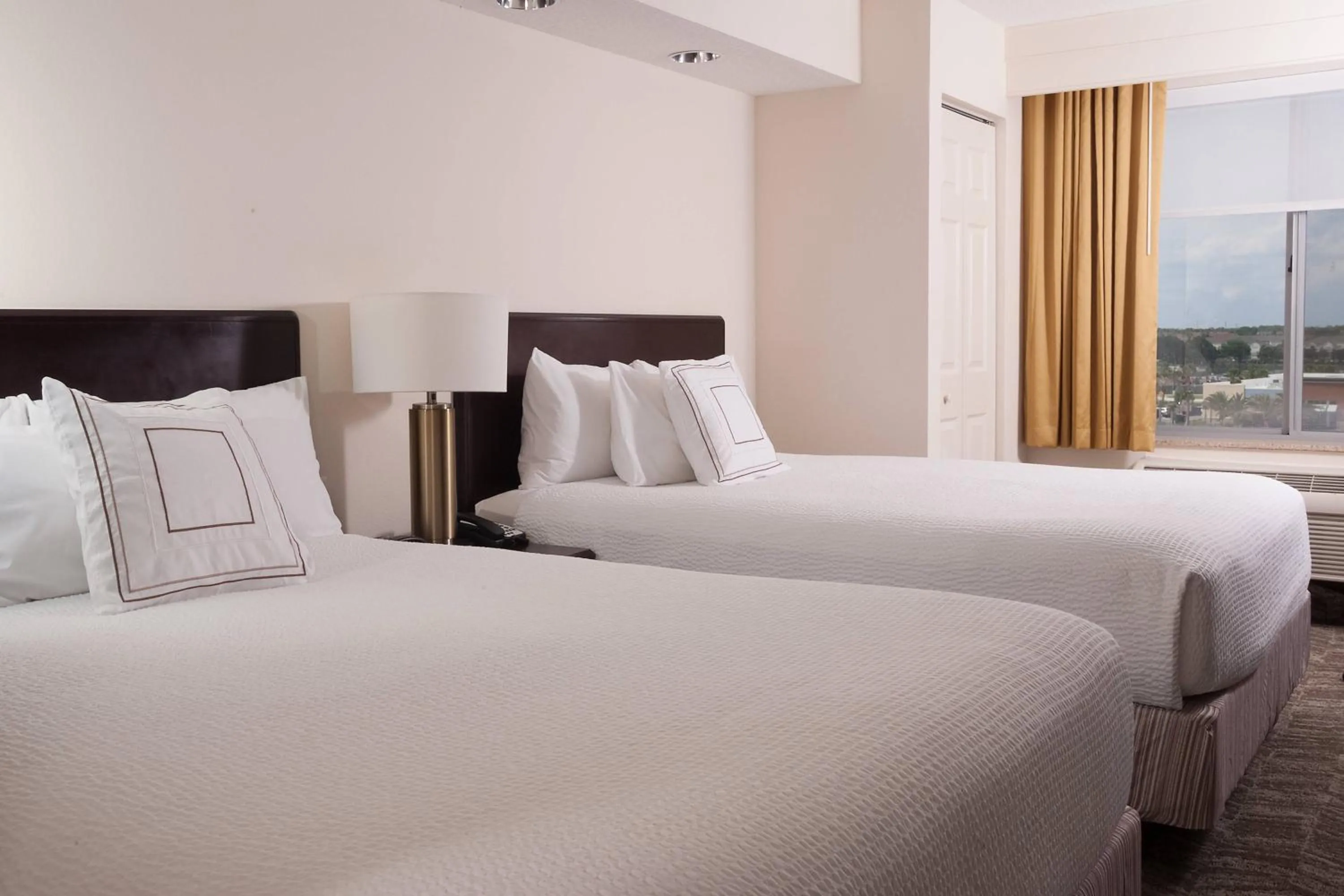 Photo of the whole room, Bed in SpringHill Suites Orlando Airport