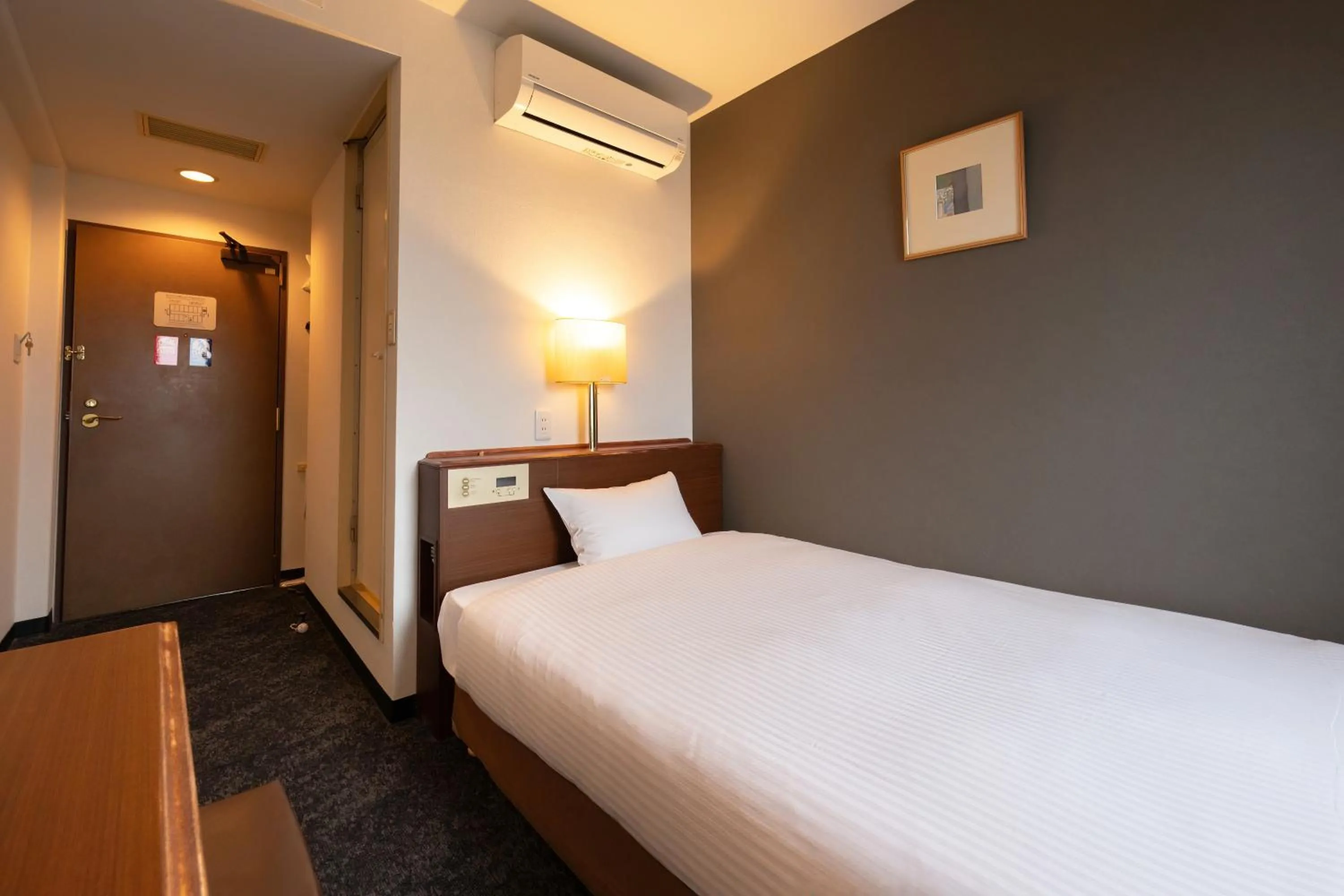 Photo of the whole room, Bed in Omura Central Hotel