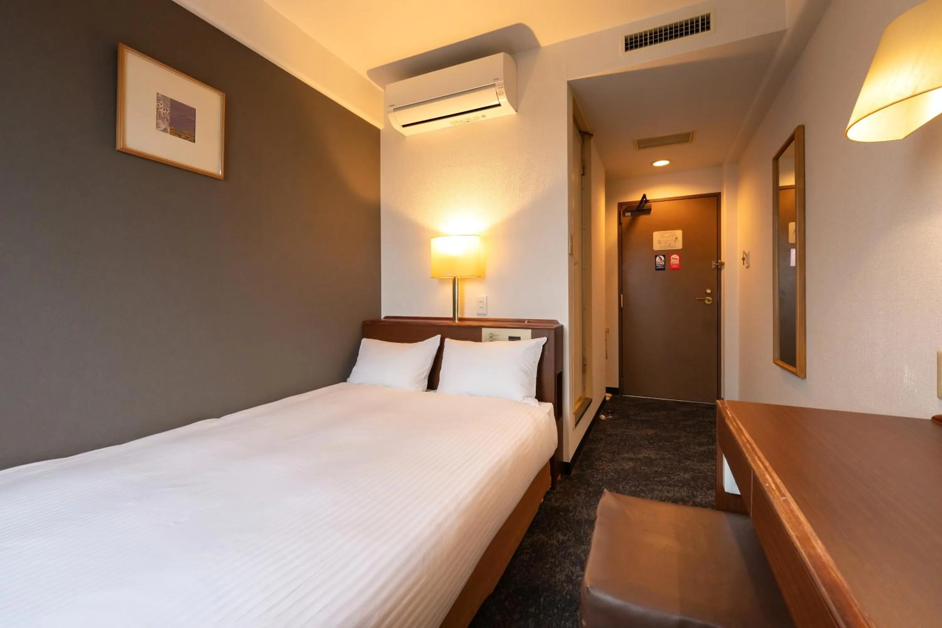 Photo of the whole room, Bed in Omura Central Hotel