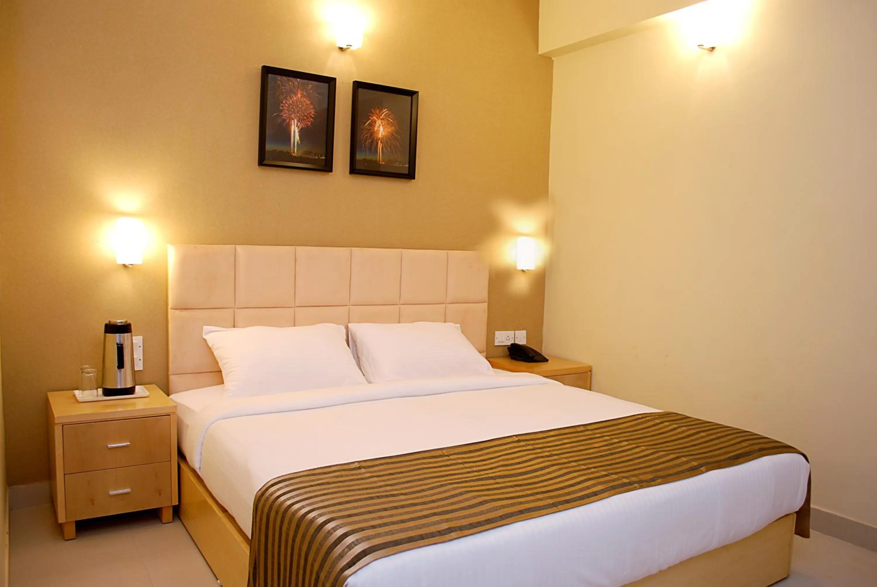 Bed in Sandalwood Hotel & Suites