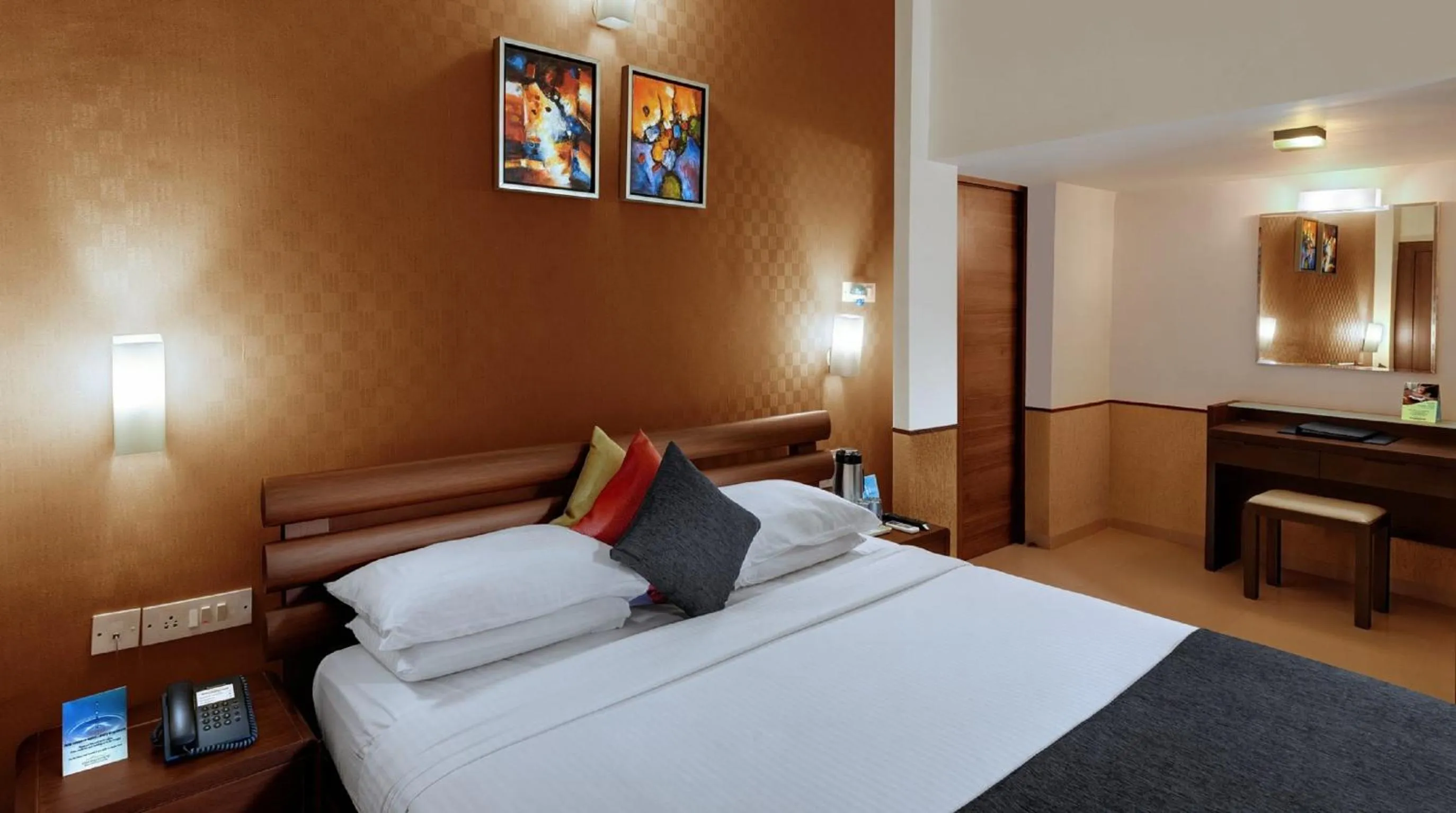 Bed in Sandalwood Hotel & Suites