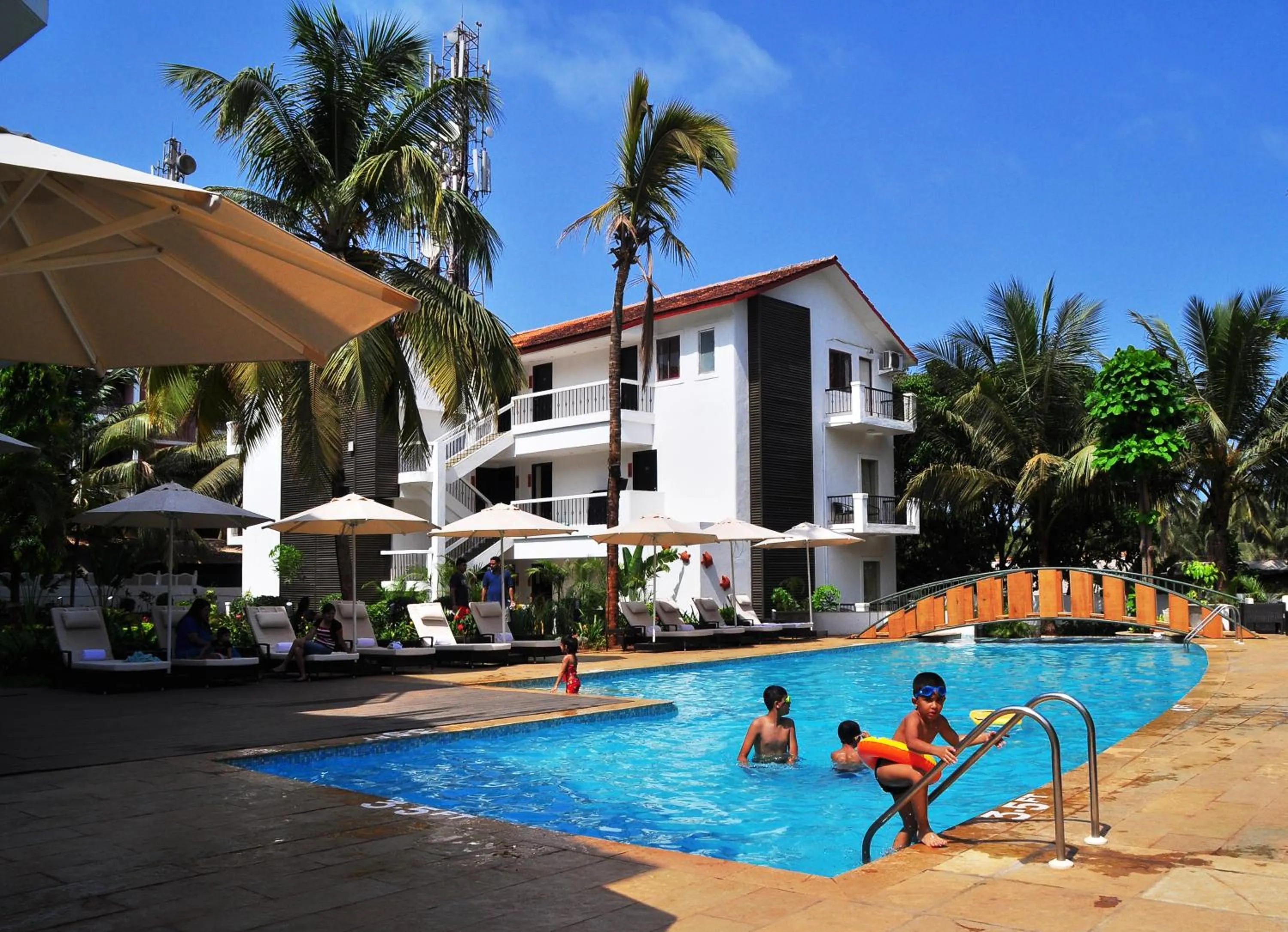 Swimming pool in Kyriad Prestige Calangute Goa by OTHPL