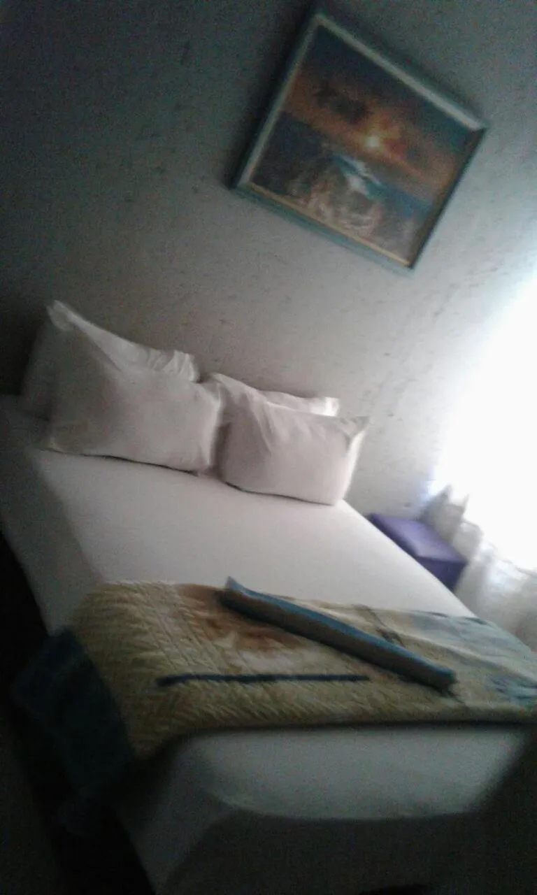 Bed in Royal Crown Guesthouse