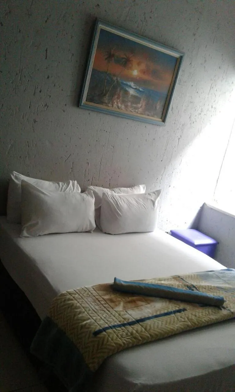 Bed in Royal Crown Guesthouse