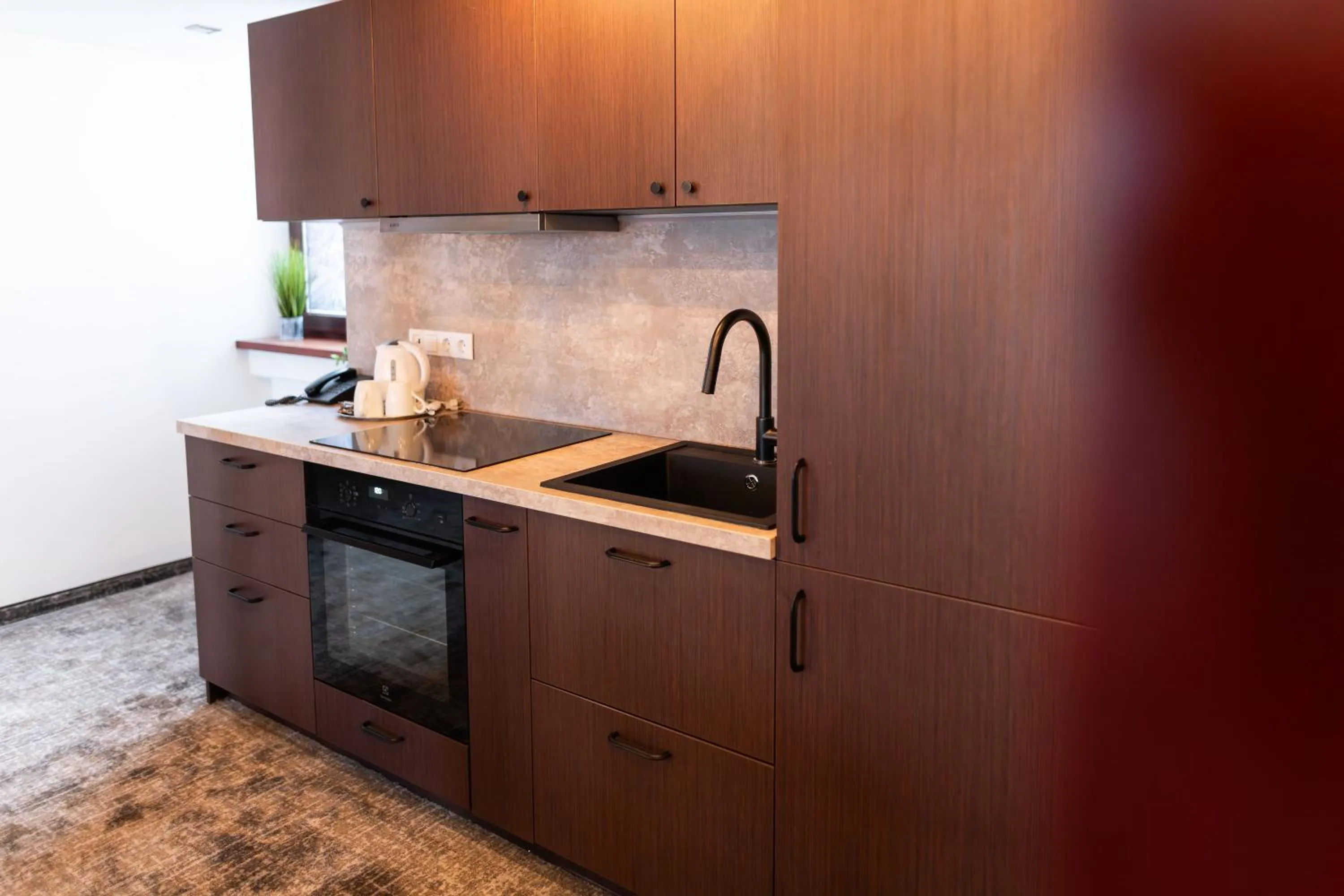 Kitchen or kitchenette in Amberton Hotel Klaipeda