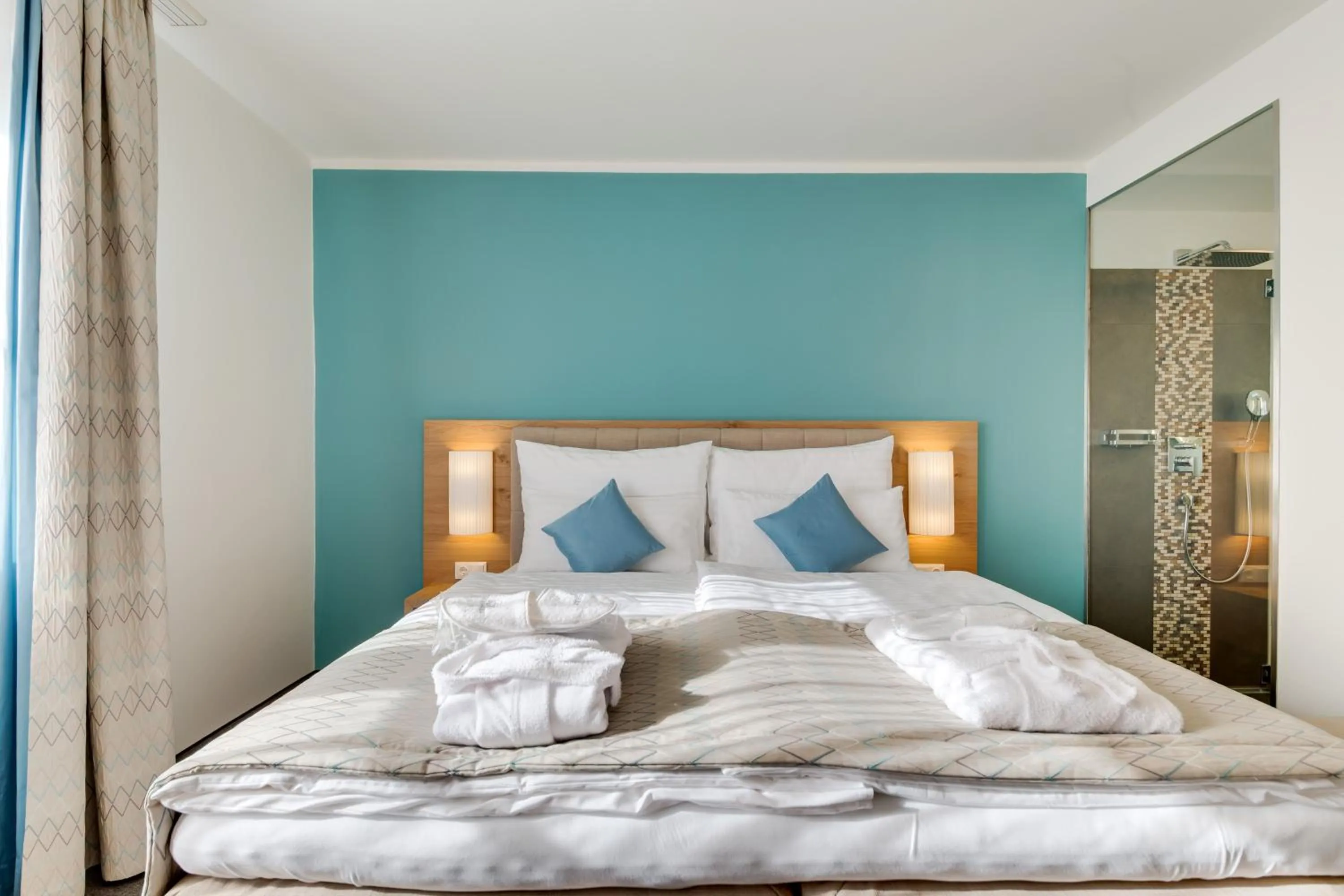 Bed in R&R Residenzen Aparthotel