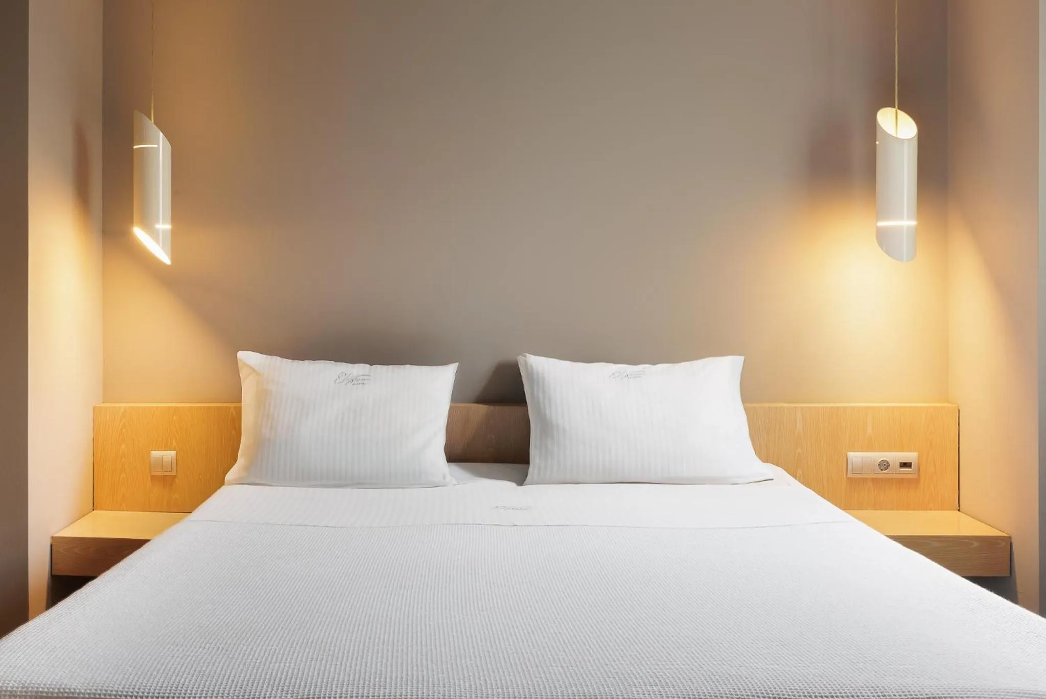 Bed in Elysion Hotel