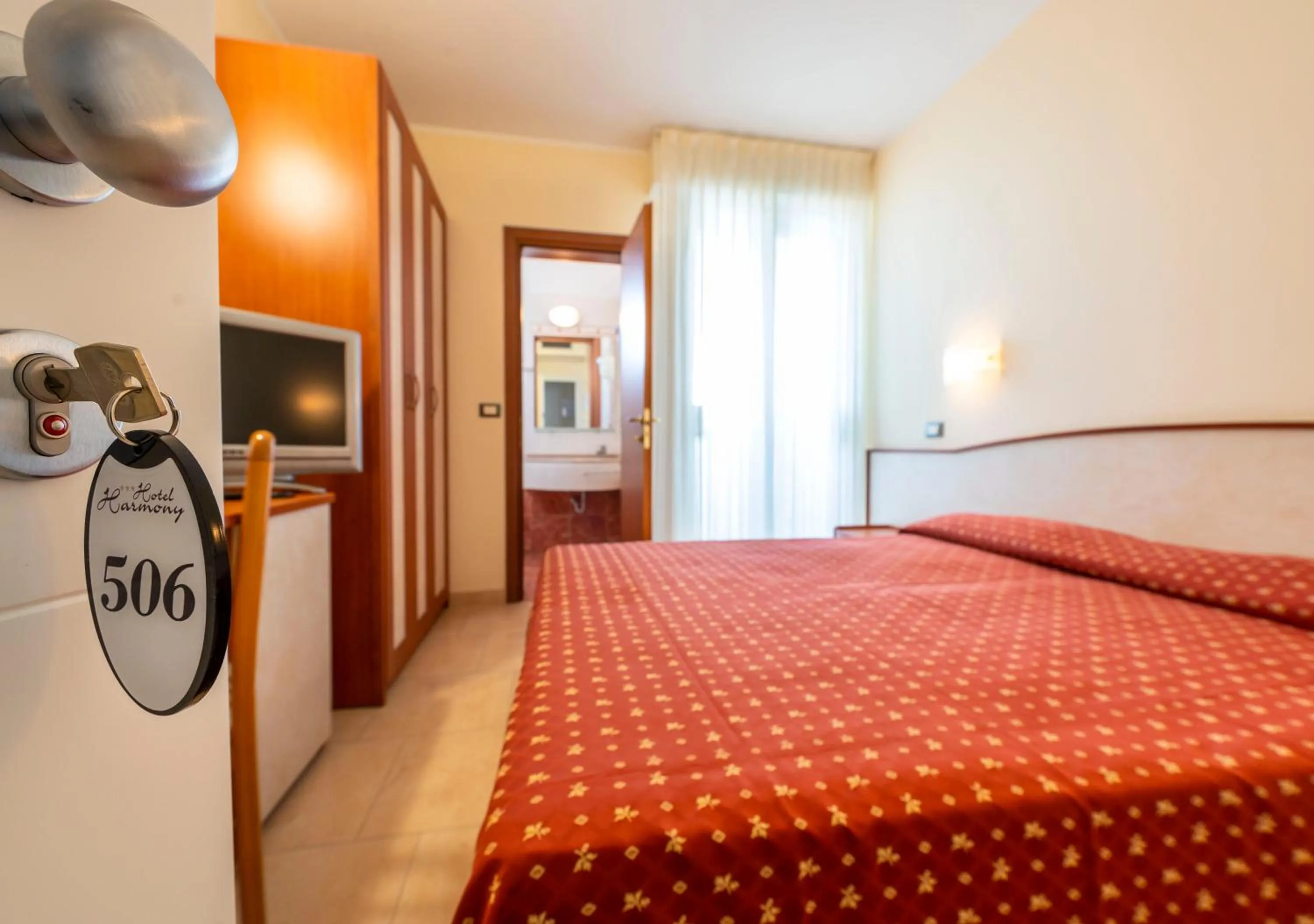 Bedroom, Bed in Hotel Harmony con Piscina panoramica