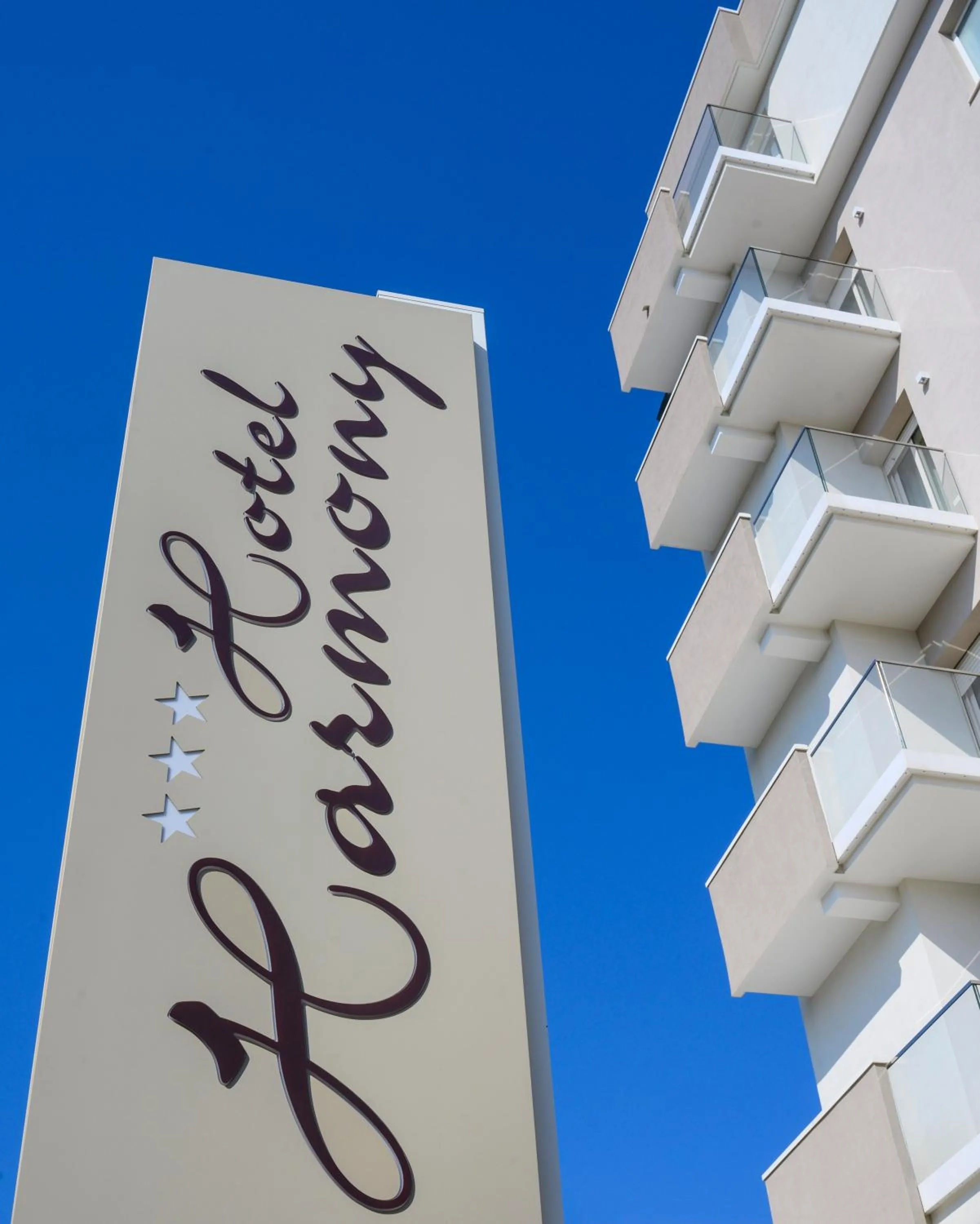 Property logo or sign in Hotel Harmony con Piscina panoramica