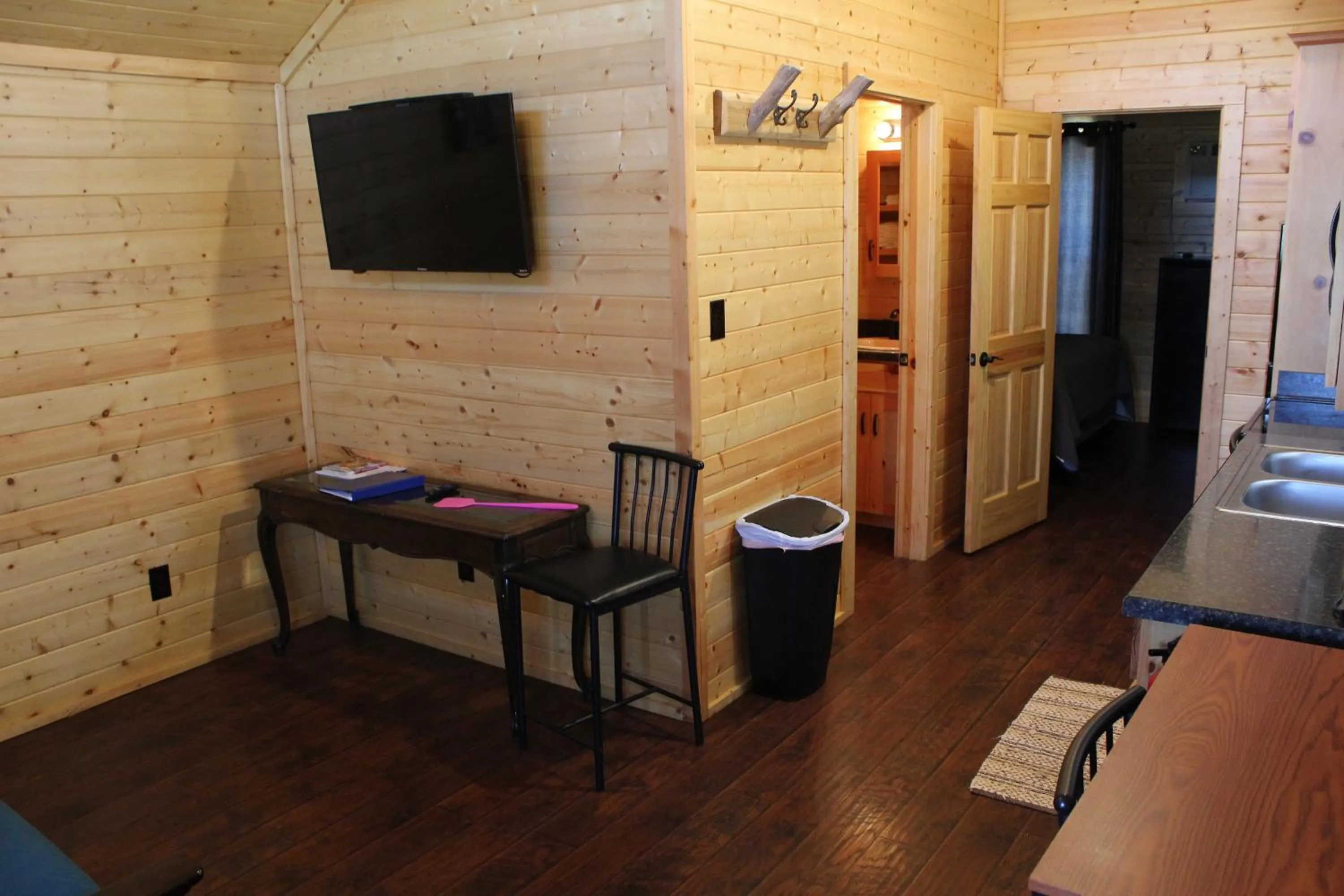 Property building, Bed in Al's Hideaway Cabin and RV Space, LLC