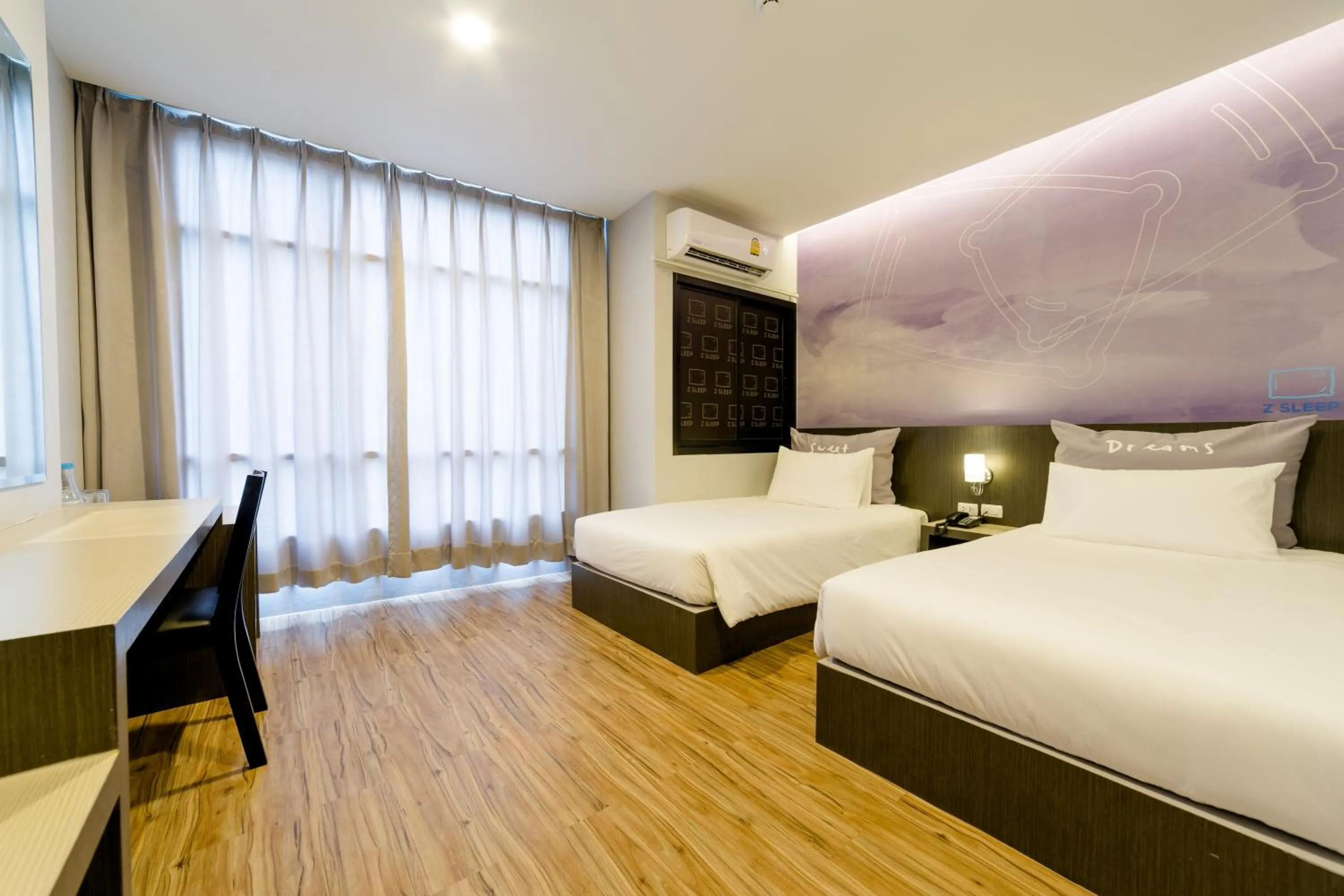 Bed in Z Sleep Hotel