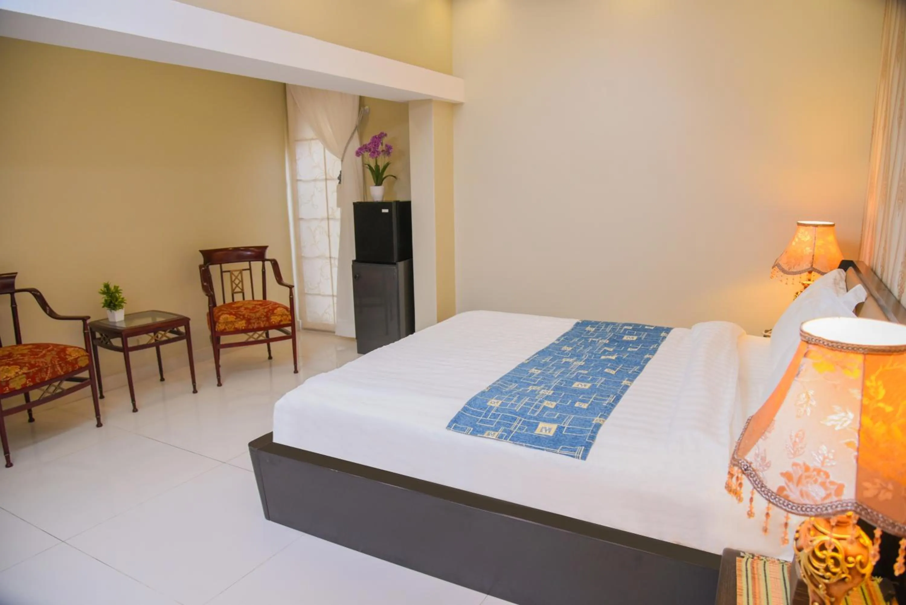 Bed in Orchards Cottage Hotel