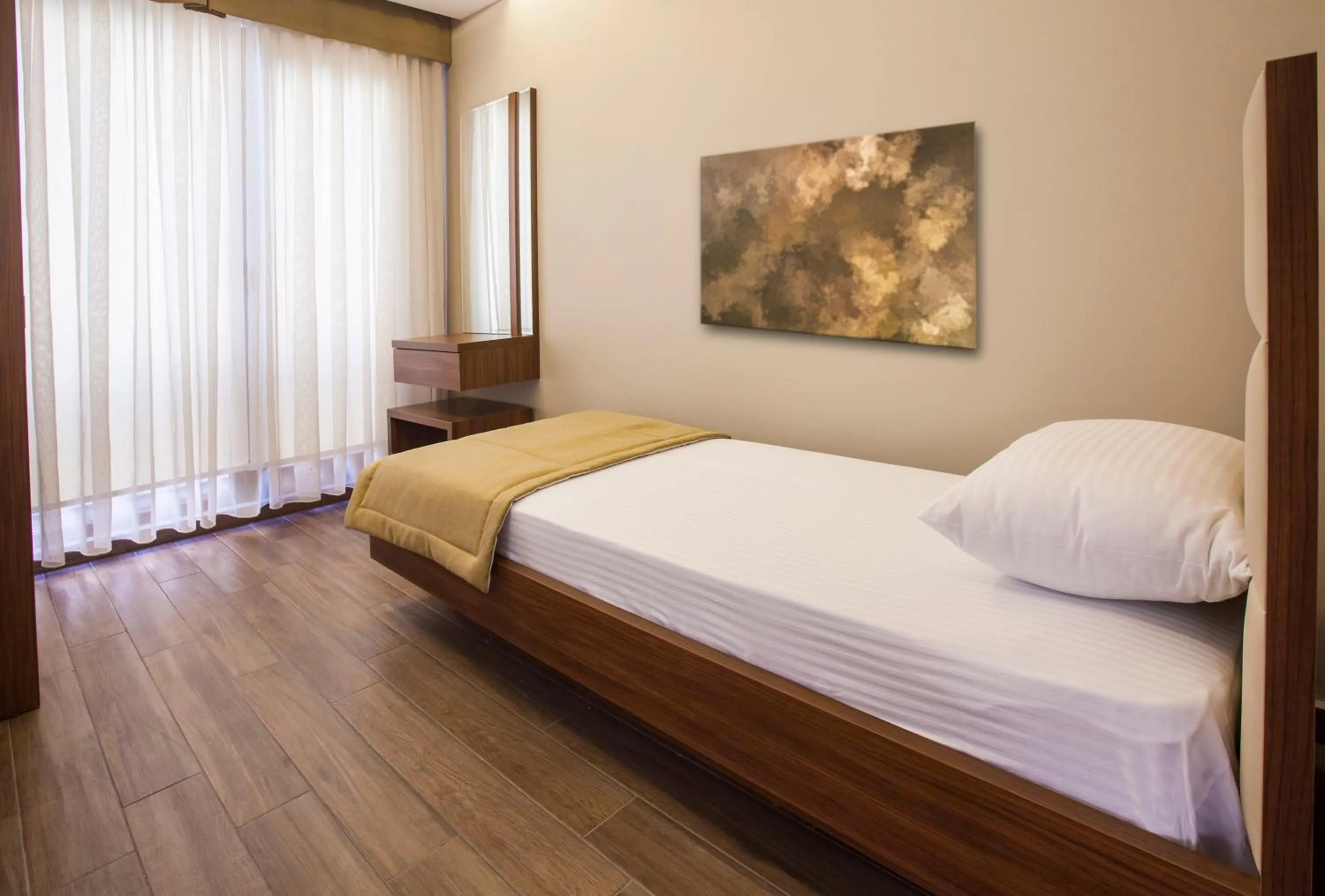 Bed in Maxuite Hotel in Home