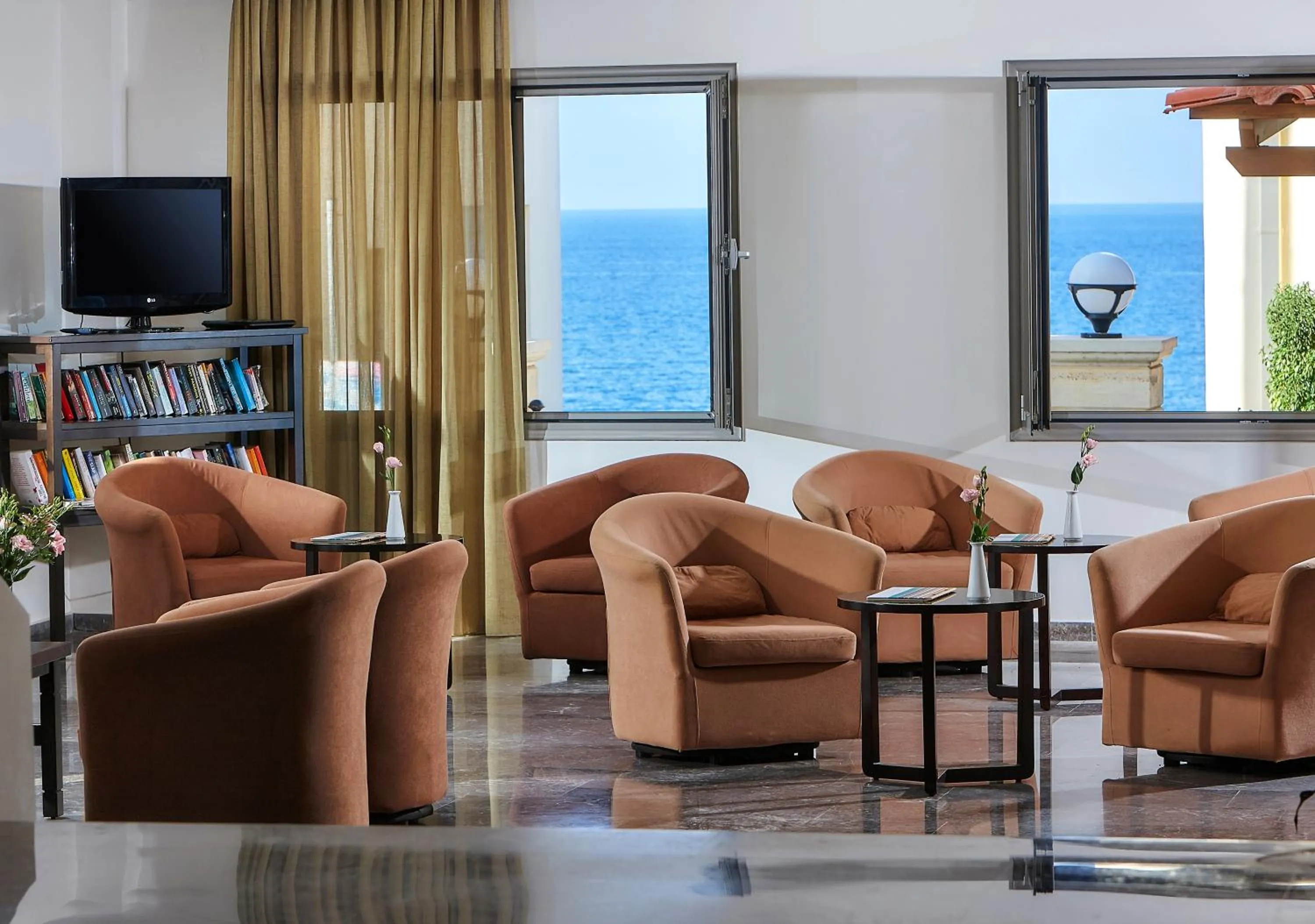 Communal lounge/ TV room in Panormo Beach Hotel