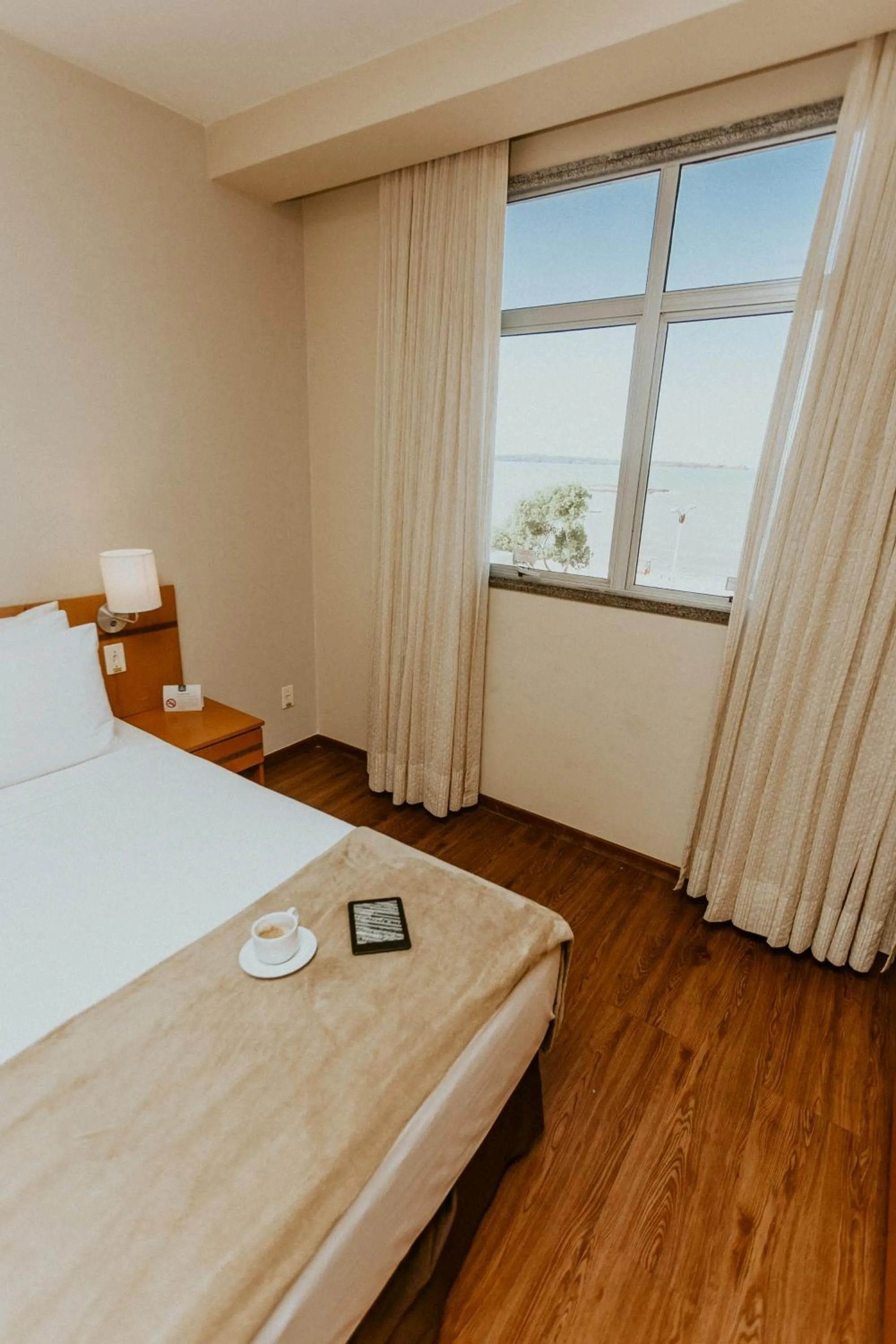 Photo of the whole room, Bed in Vitoria Praia Hotel