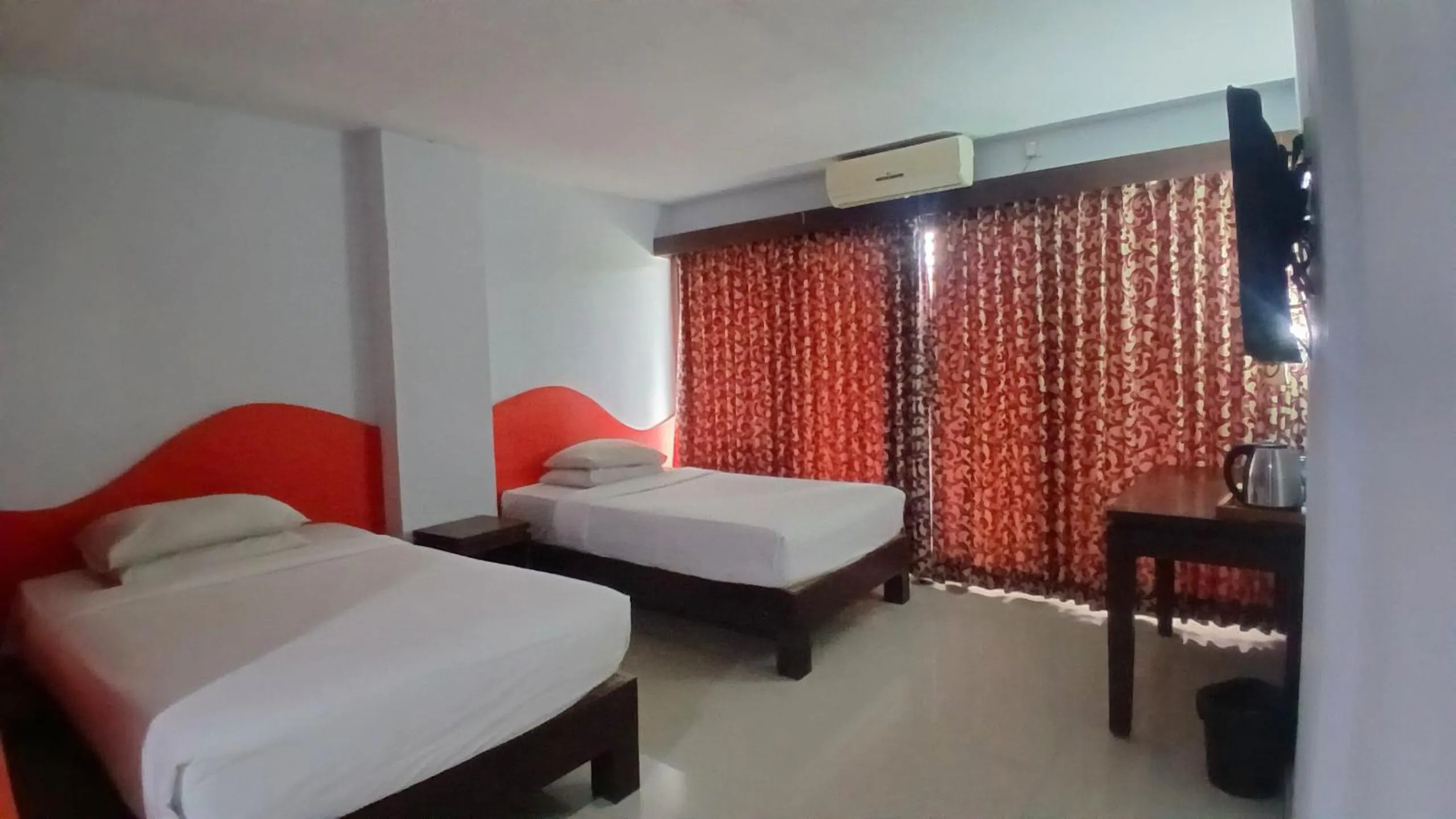 Bedroom, Bed in Nirmala Hotel & Convention Centre