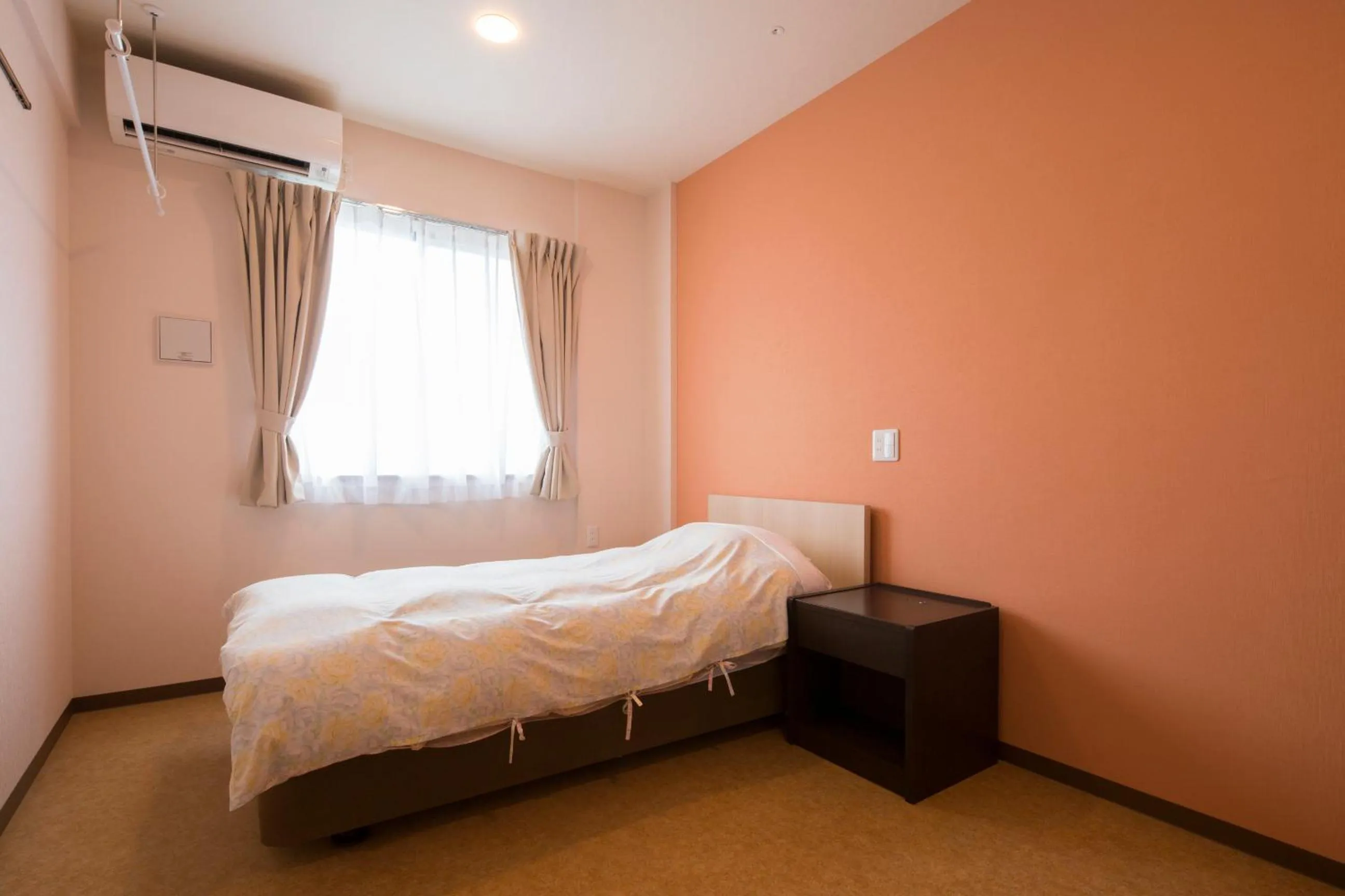 Bed in Hotel Asahi Grandeur Fuchu