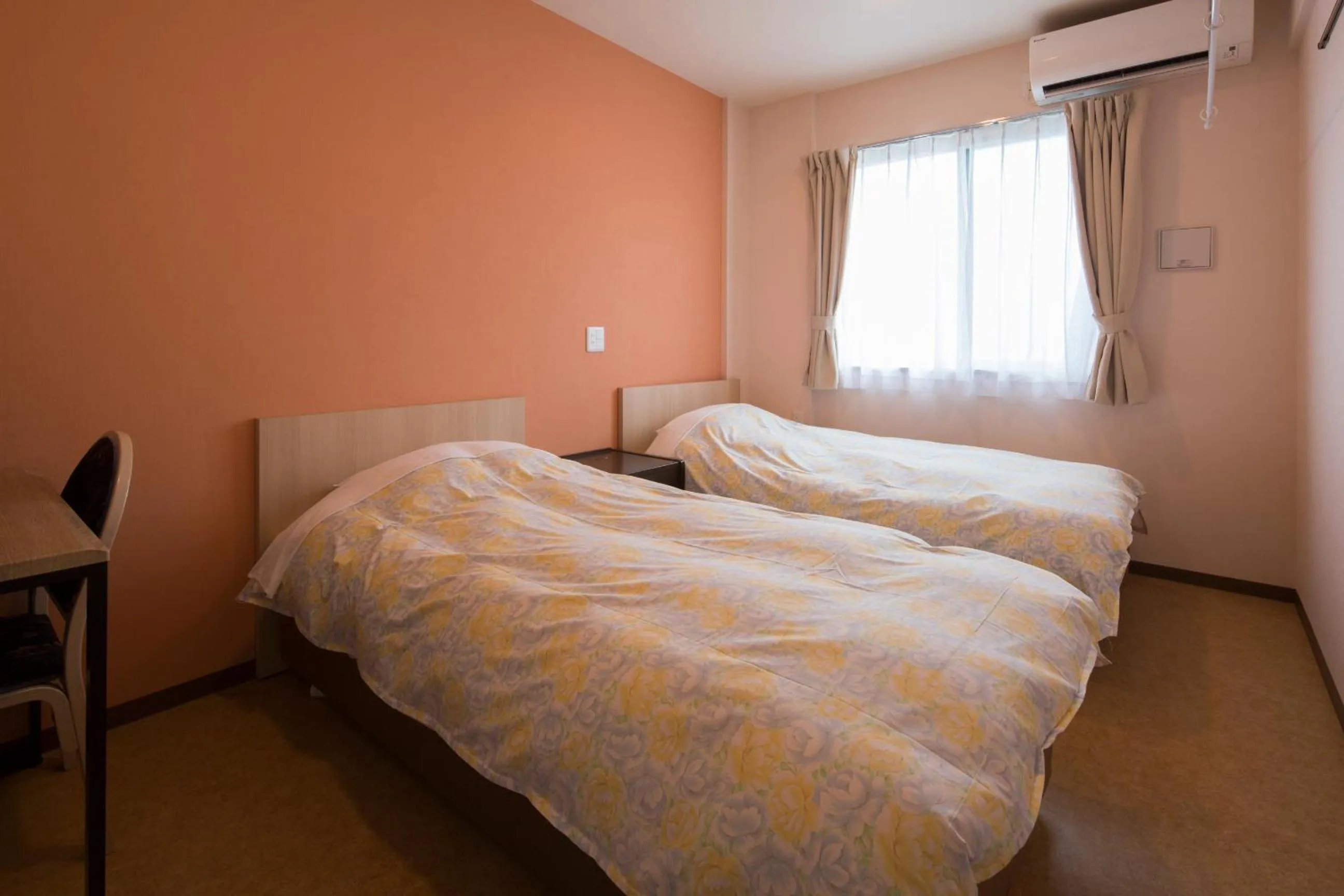 Bed in Hotel Asahi Grandeur Fuchu