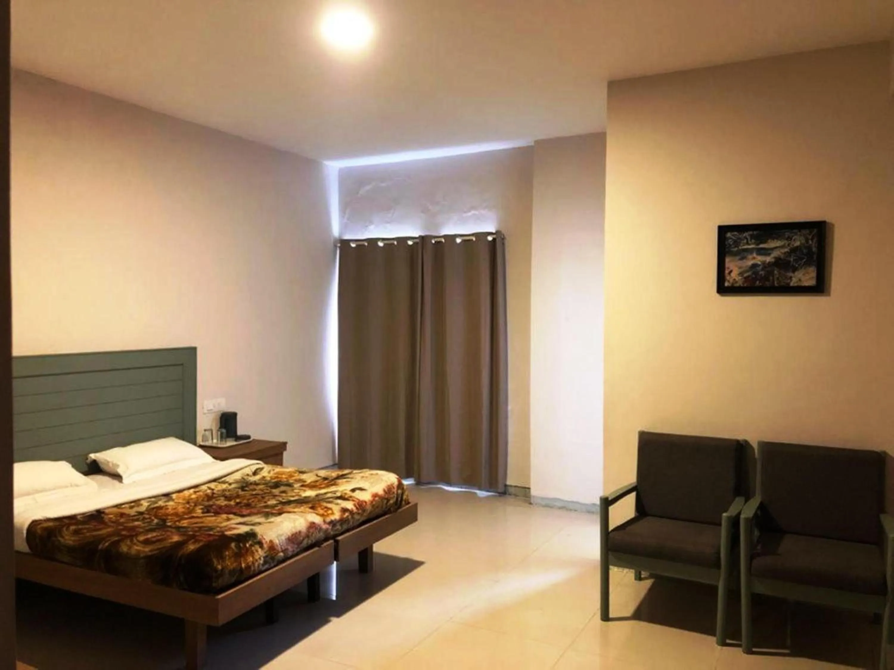 Bed in Hotel Preethi Palace