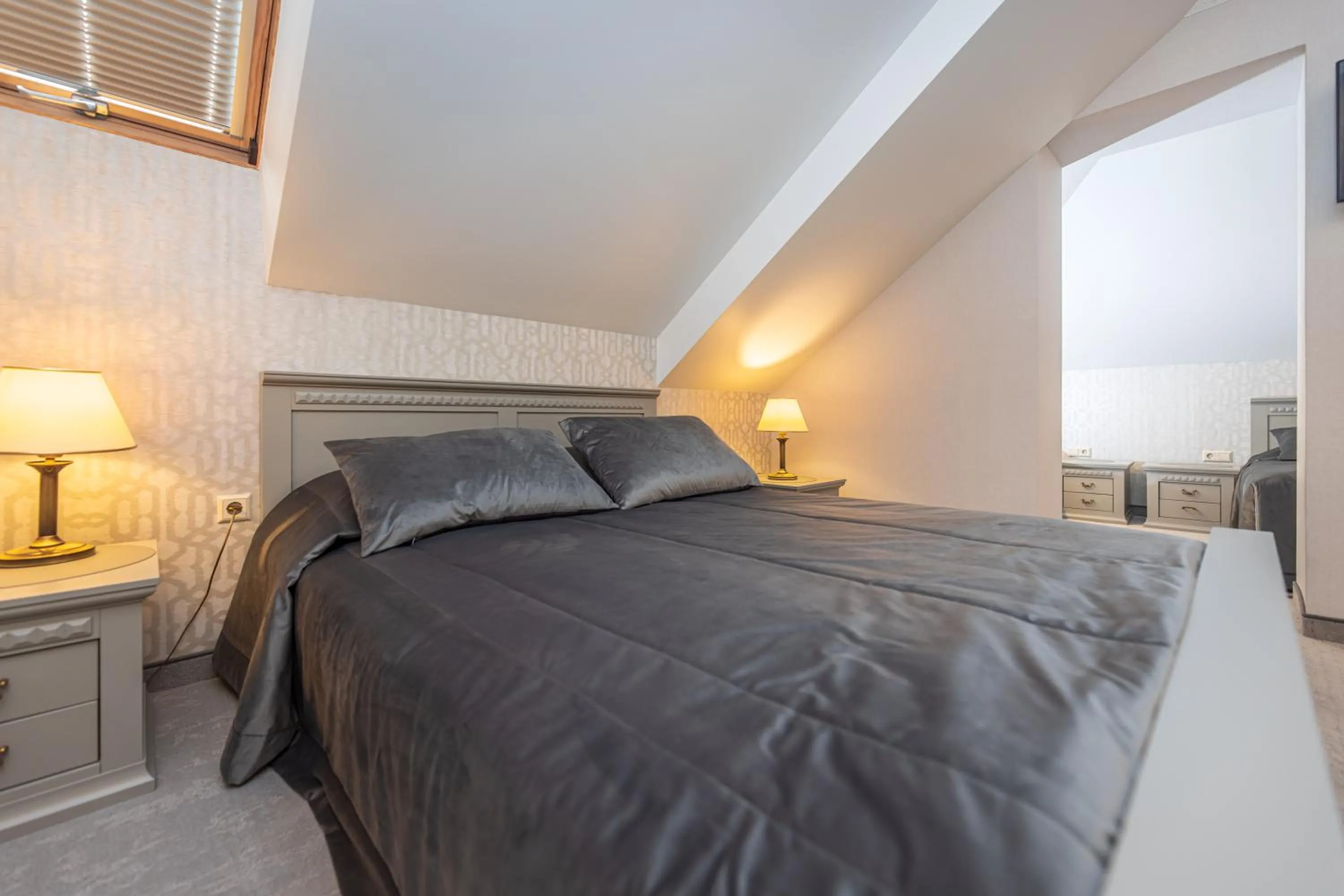 Bed in Senoji Hansa Hotel