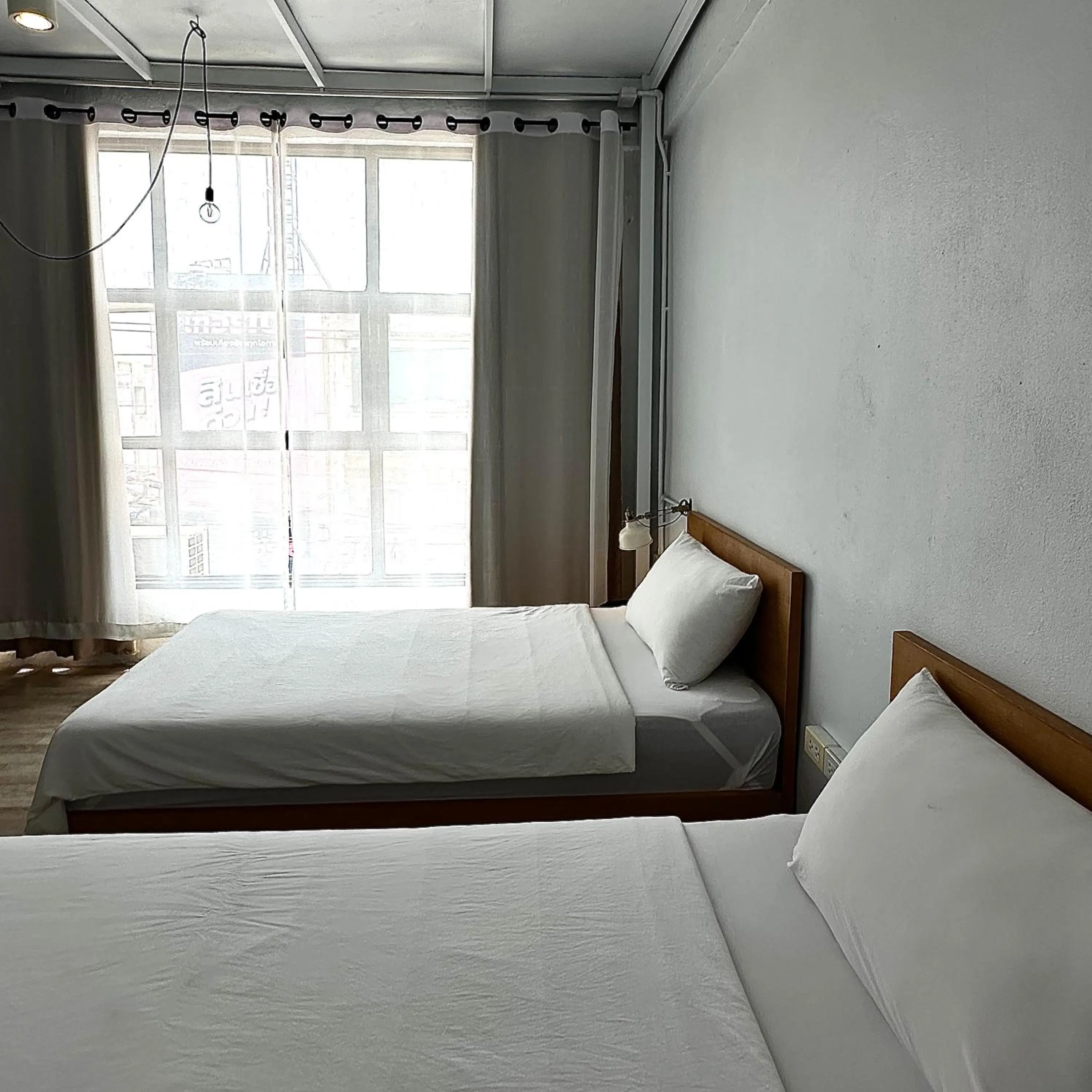 Bed in Beige Poshtels + Netflix