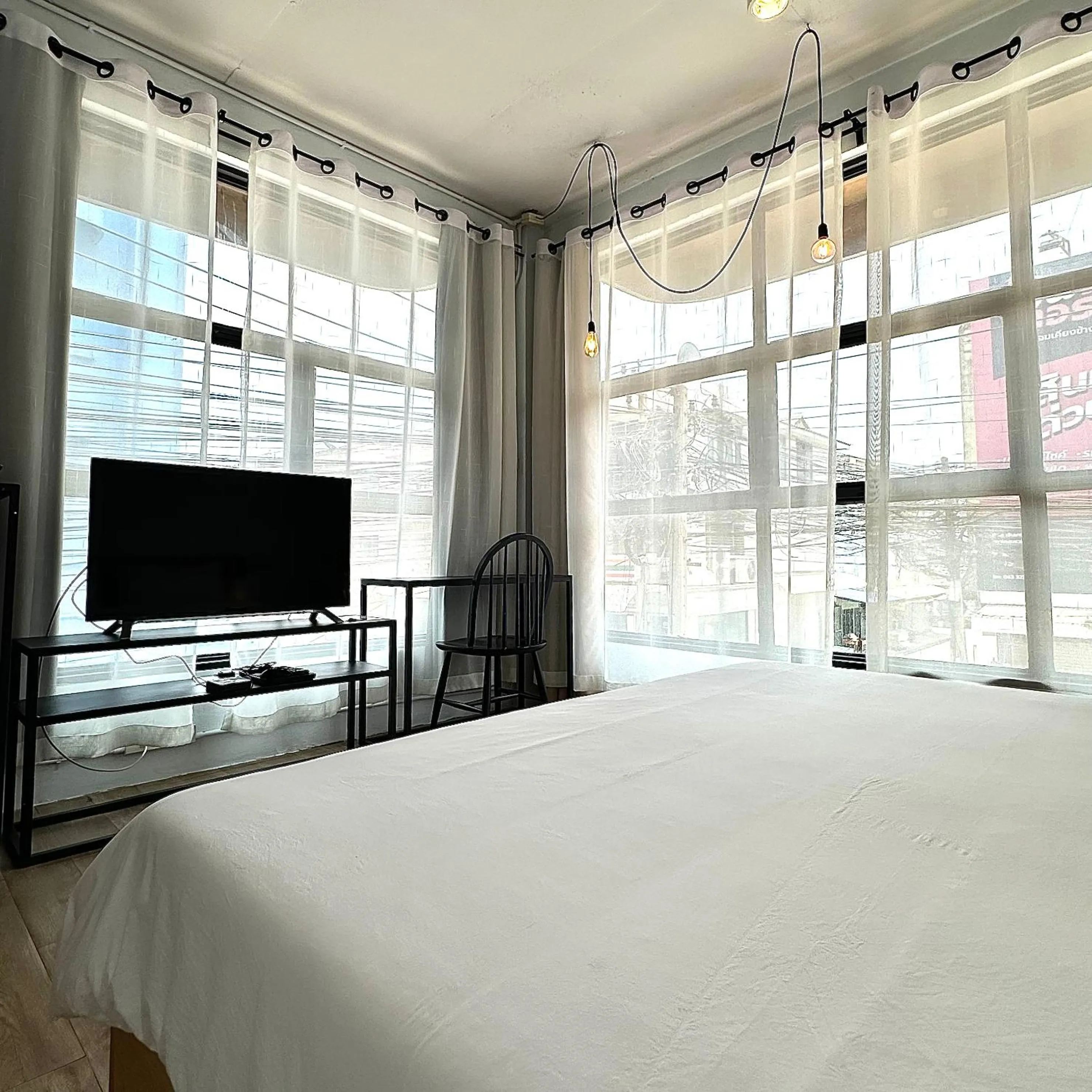 Bed in Beige Poshtels + Netflix