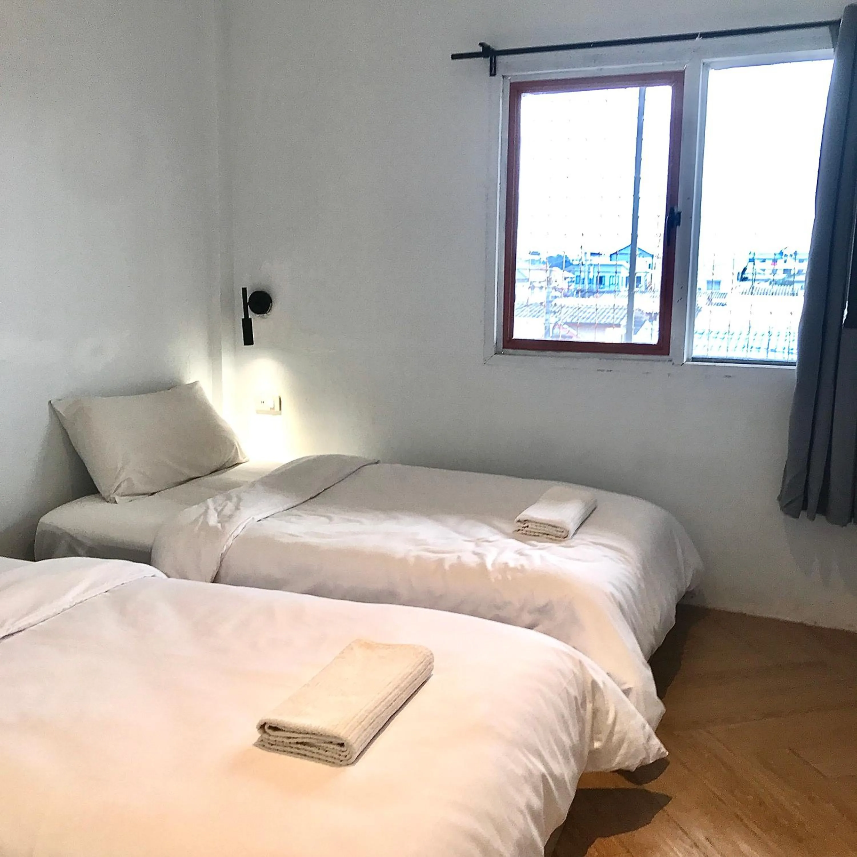 Bed in Beige Poshtels + Netflix