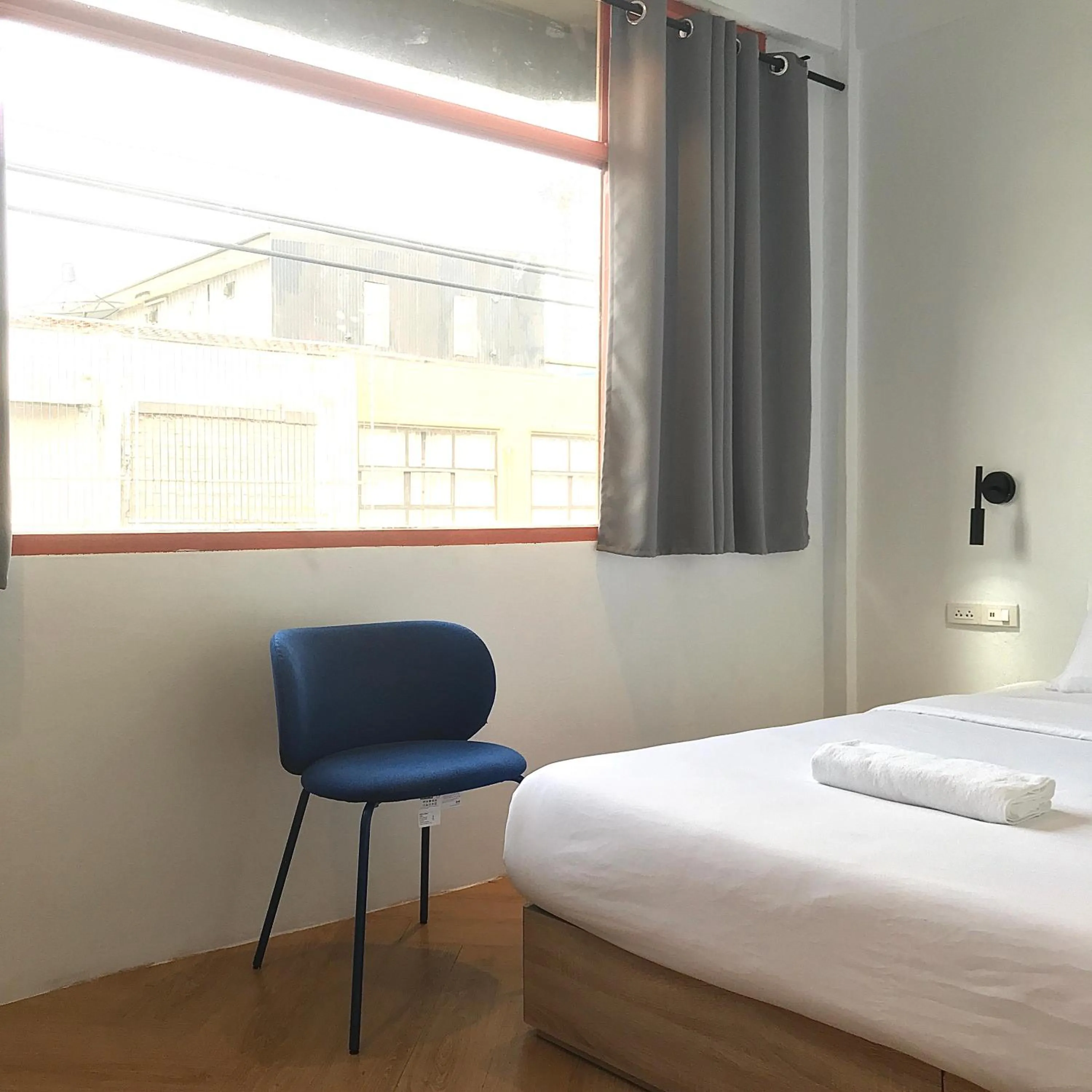 Bed in Beige Poshtels + Netflix