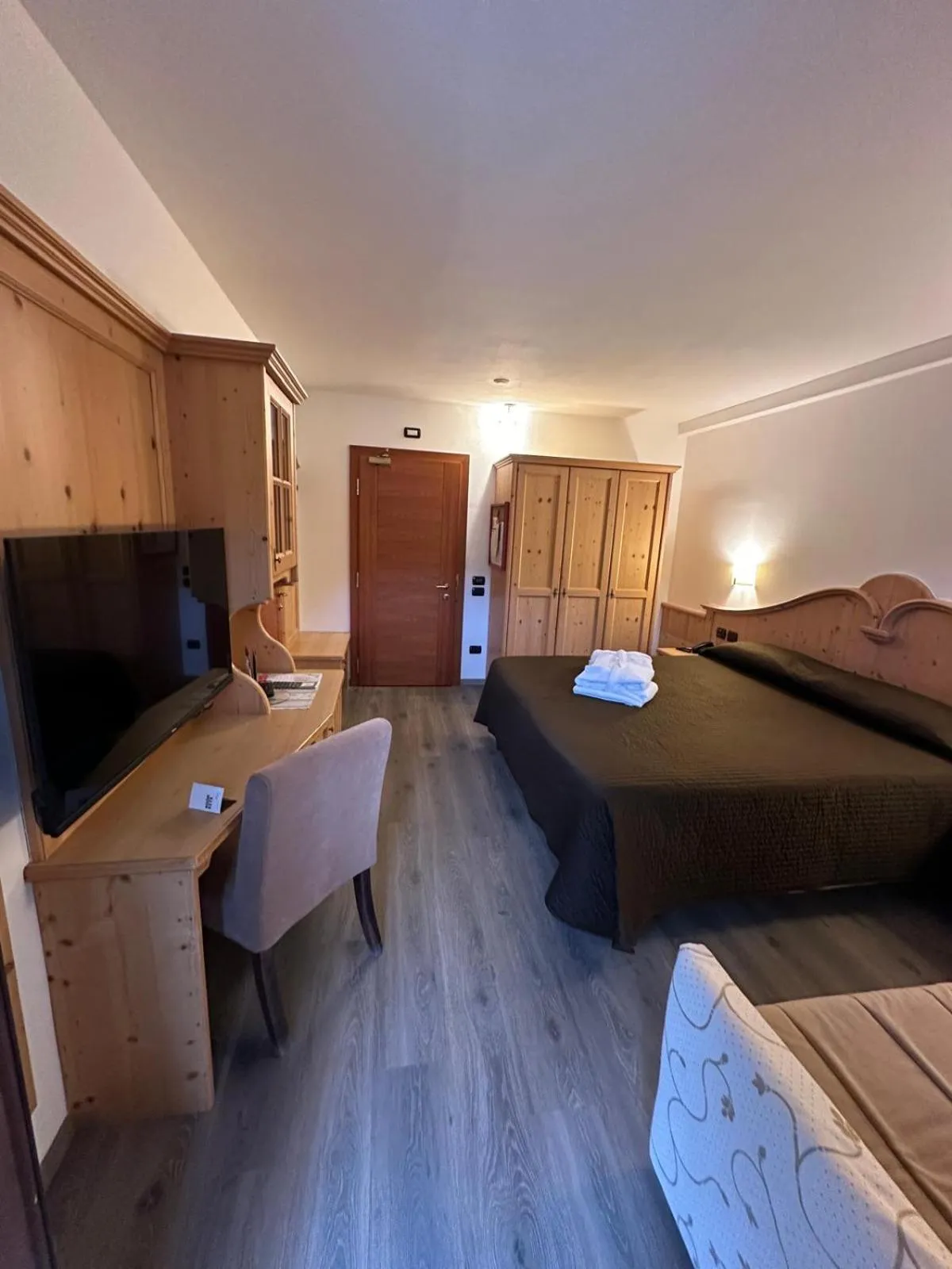 Bed in Hotel Isolabella Wellness