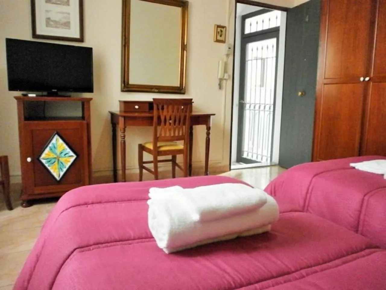 Bed in I Cappuccini Rooms