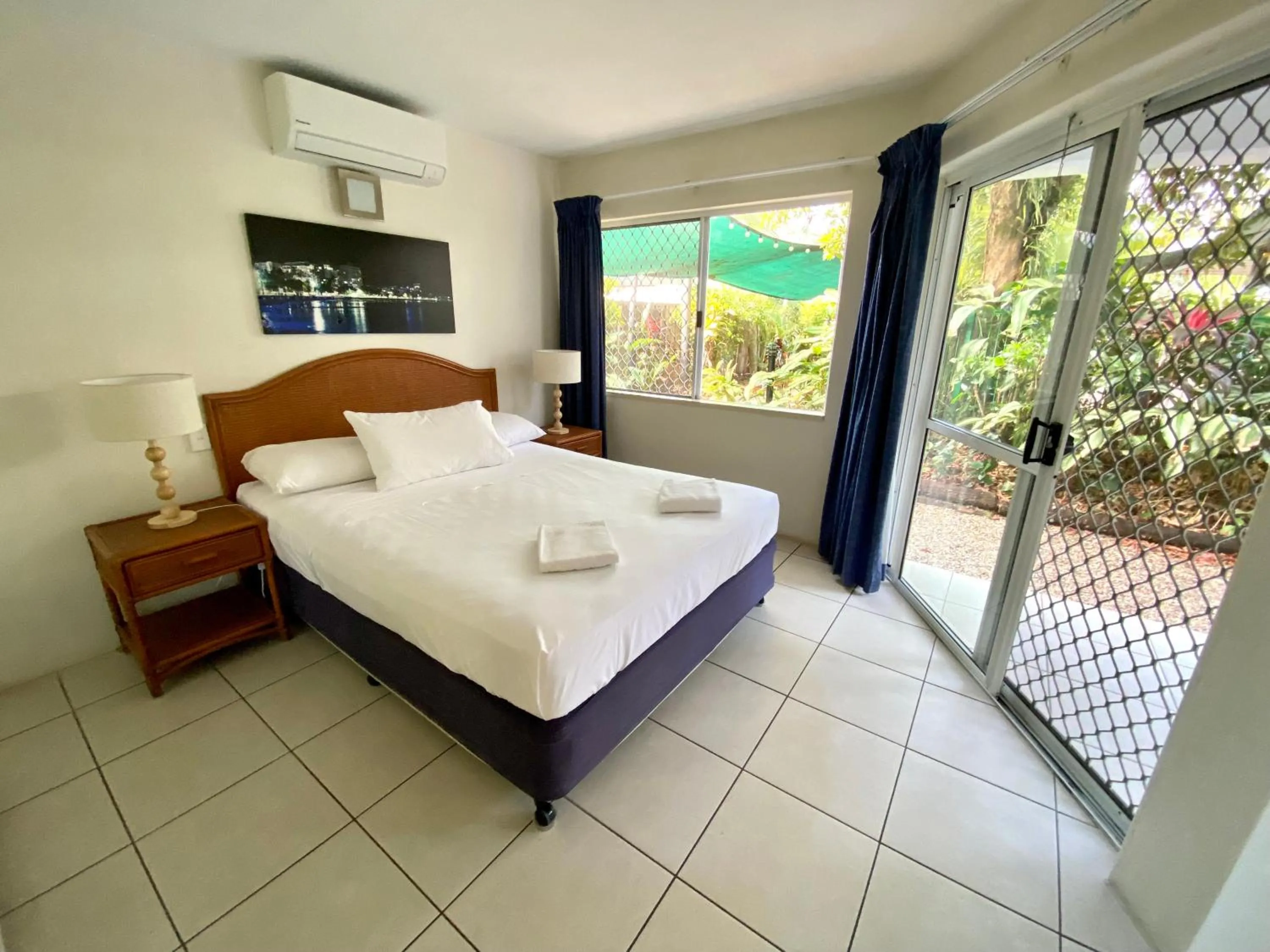 Bed in Reef Gateway Apartments