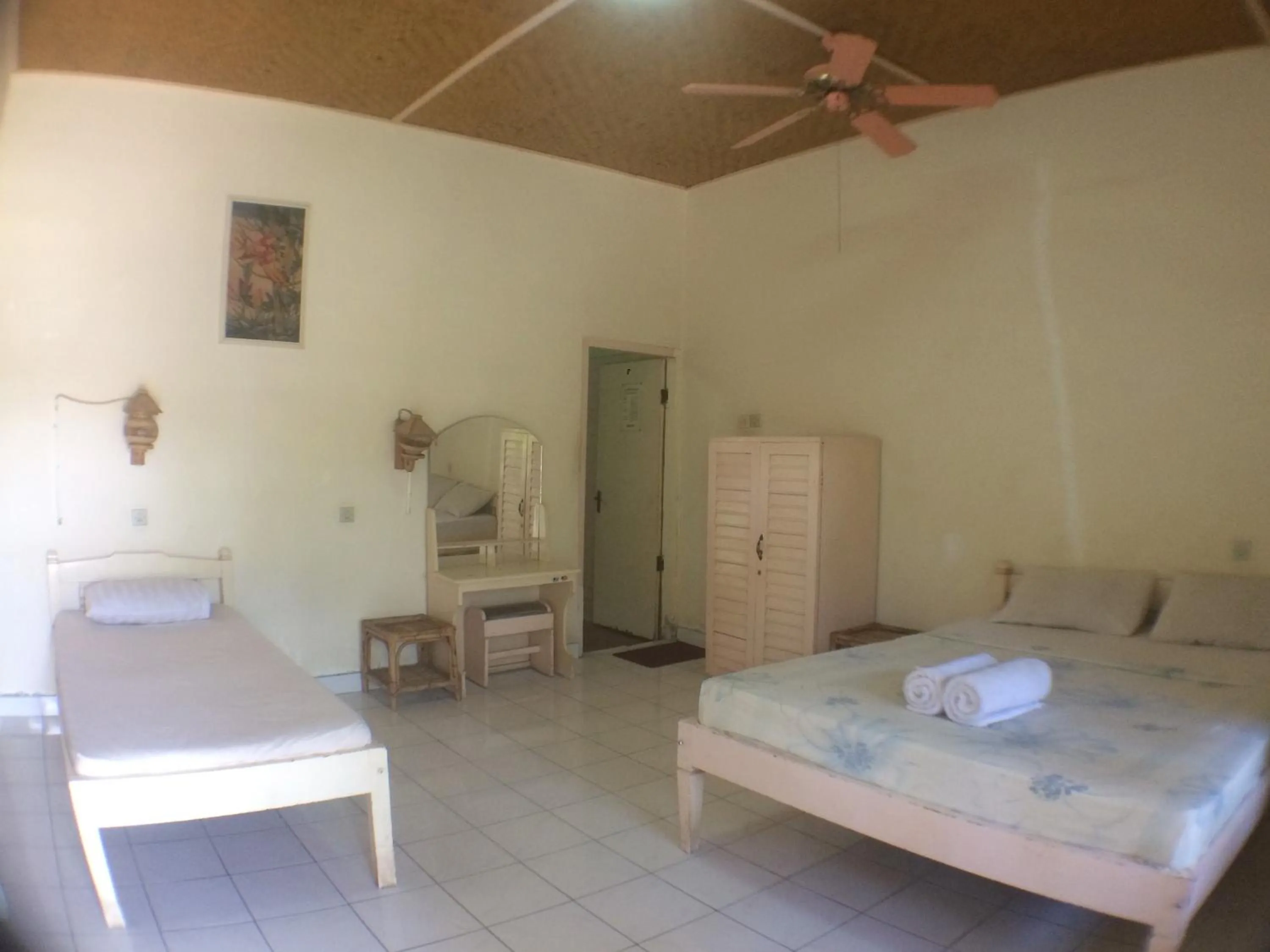 Bed in Taman Lily's Hotel